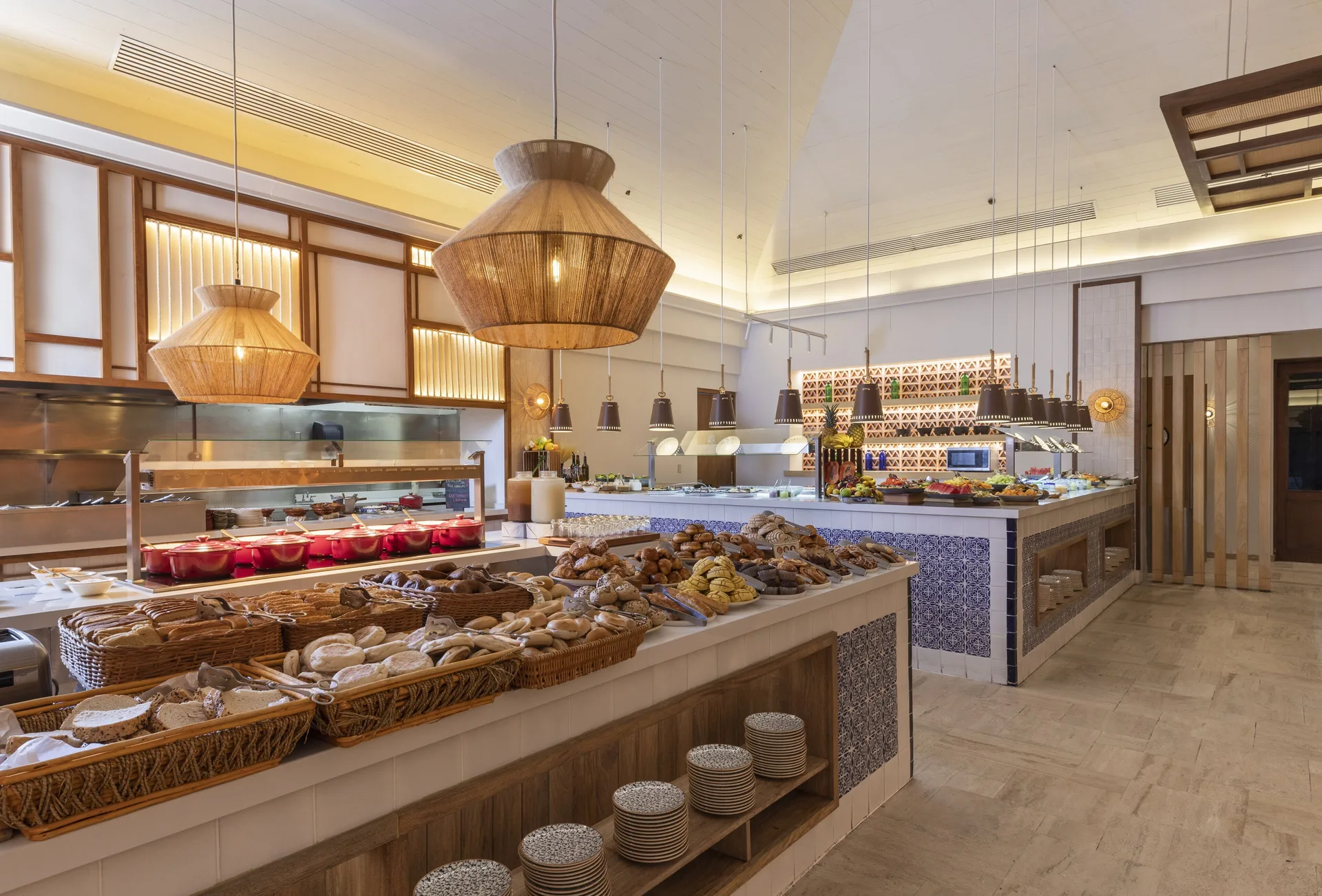 Breakfast buffet with baskets of bread and pastries at Fairmont Mayakoba.