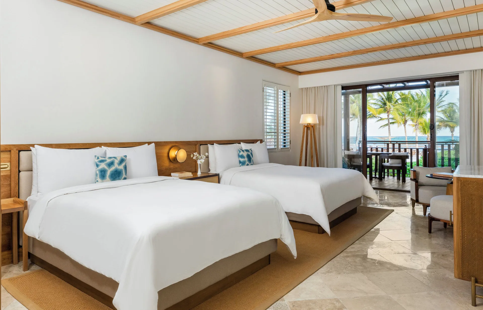Beachfront Casita with two queen beds and ocean-view balcony at Fairmont Mayakoba.