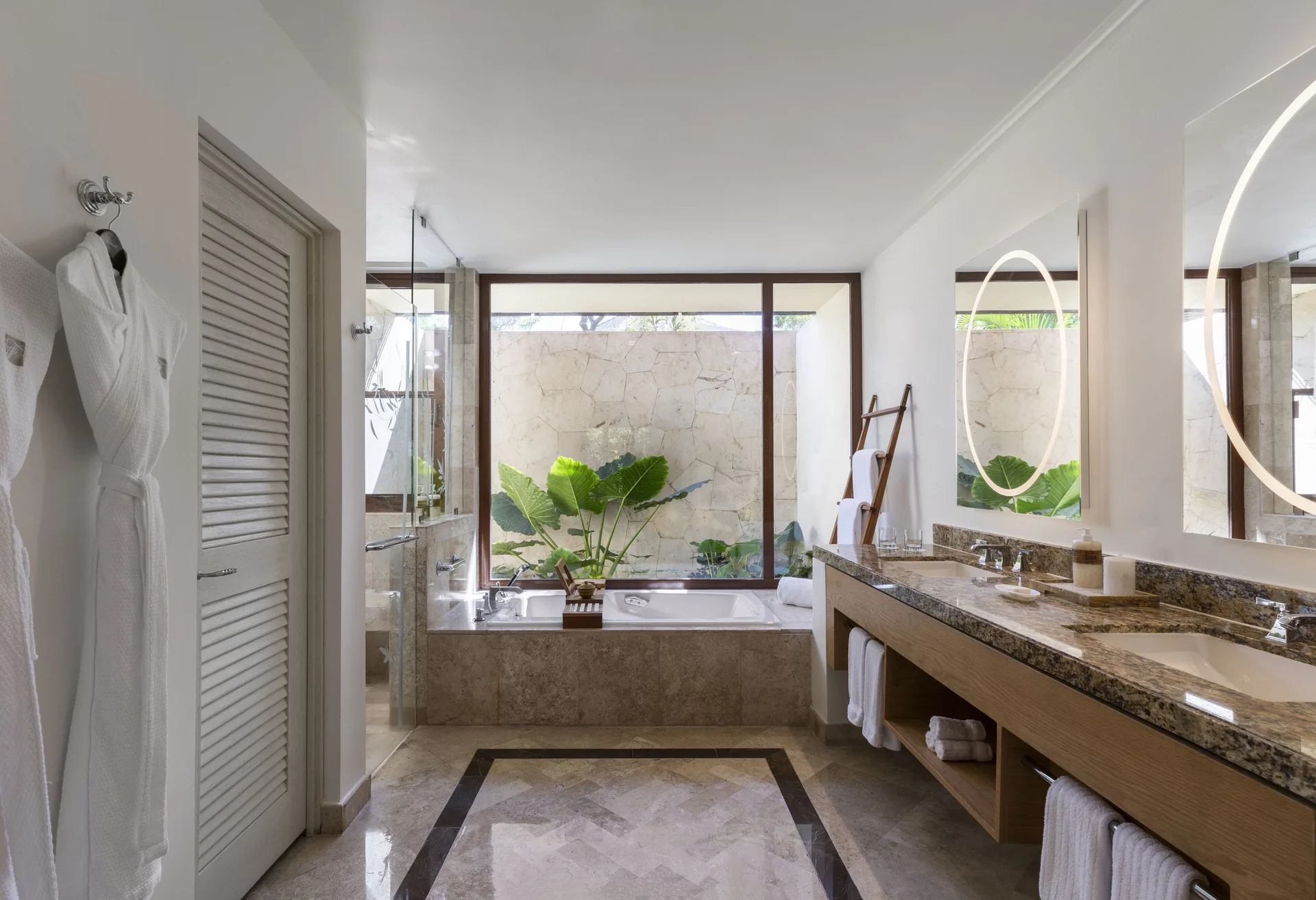 Casita Deluxe Room bathroom at Fairmont Mayakoba with double vanity, tub, shower, and garden view.