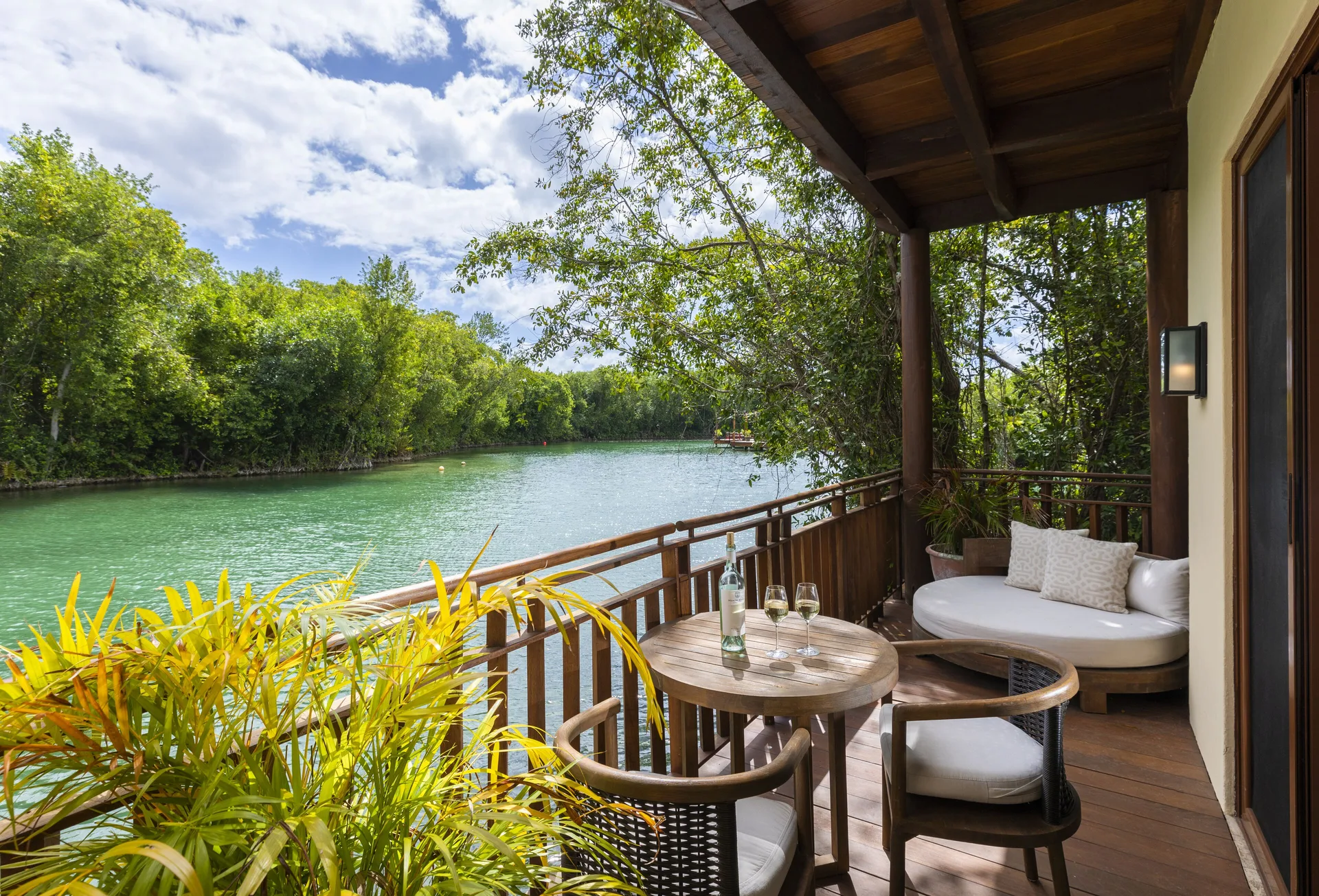 Casita Signature suite balcony with lagoon seating at Fairmont Mayakoba.