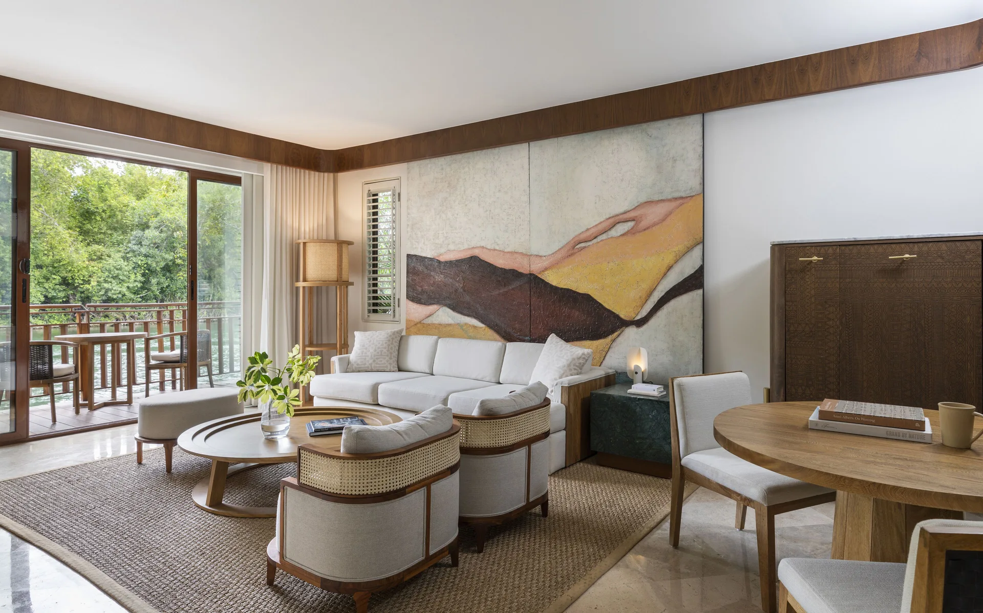 Casita Signature suite living room with balcony and dining table at Fairmont Mayakoba.