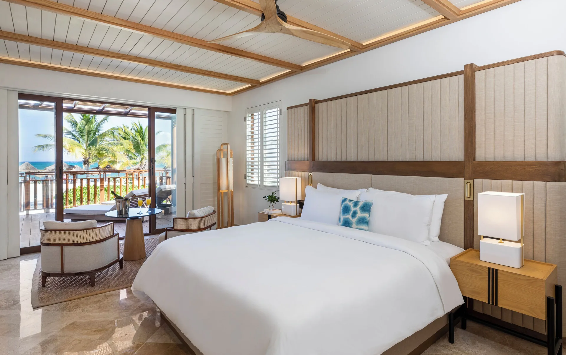 Premium Suite beachfront king bedroom with balcony view at Fairmont Mayakoba.