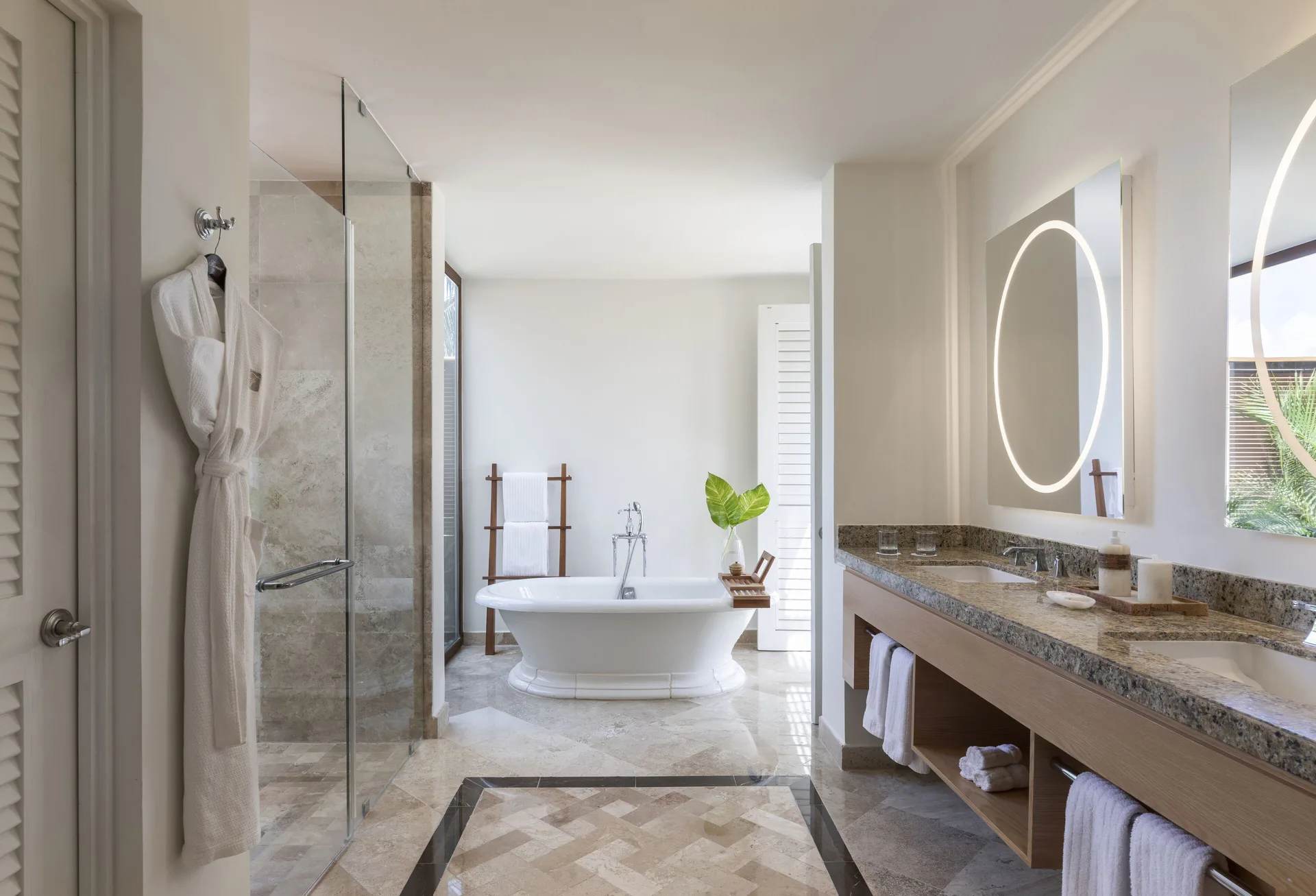 Presidential Suite bathroom with double vanity and freestanding tub at Fairmont Mayakoba.