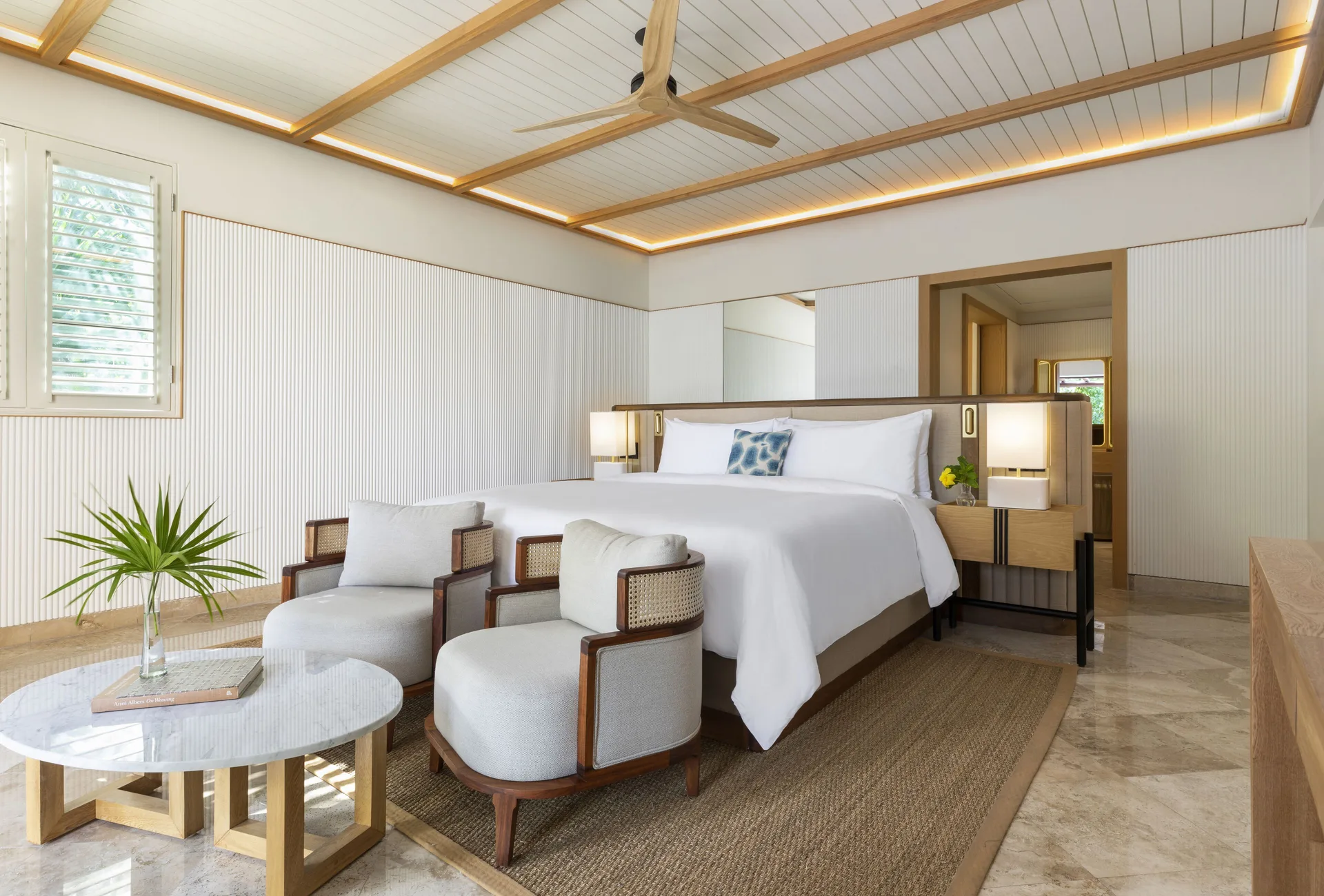 Presidential Suite king bedroom with sitting area at Fairmont Mayakoba.
