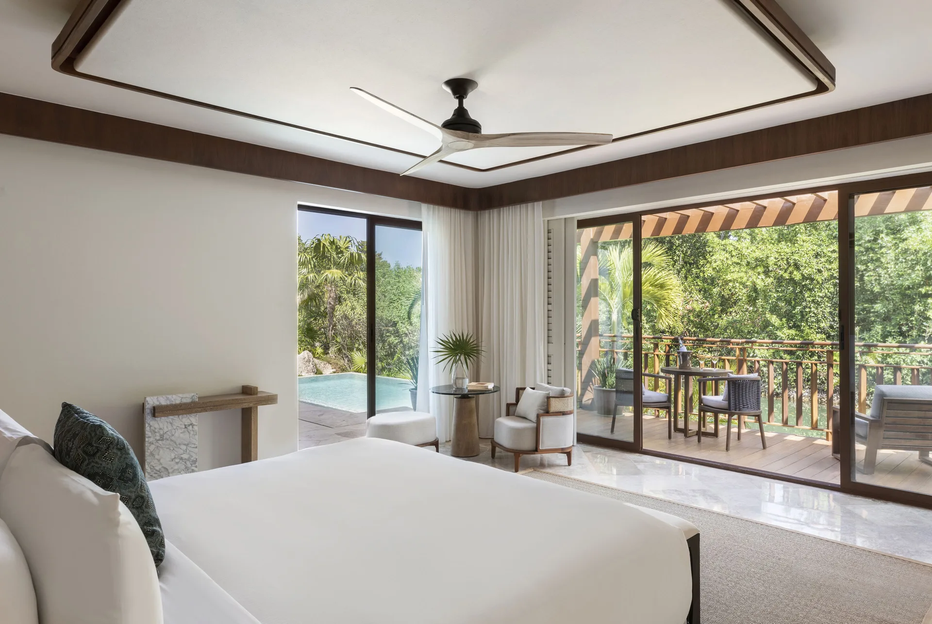 Presidential Suite bedroom with terrace and pool at Fairmont Mayakoba.
