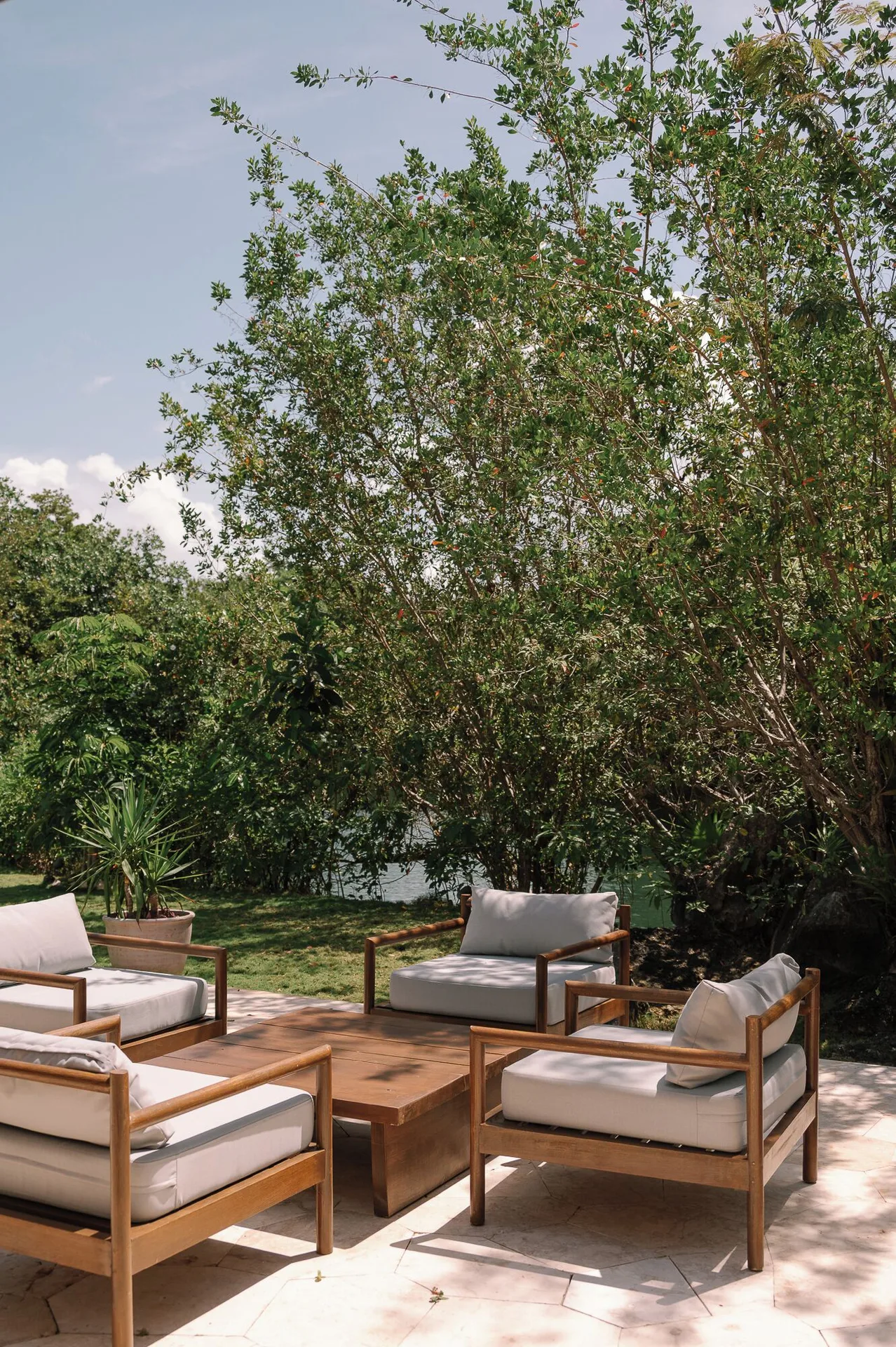 Presidential Suite outdoor seating by trees at Fairmont Mayakoba.