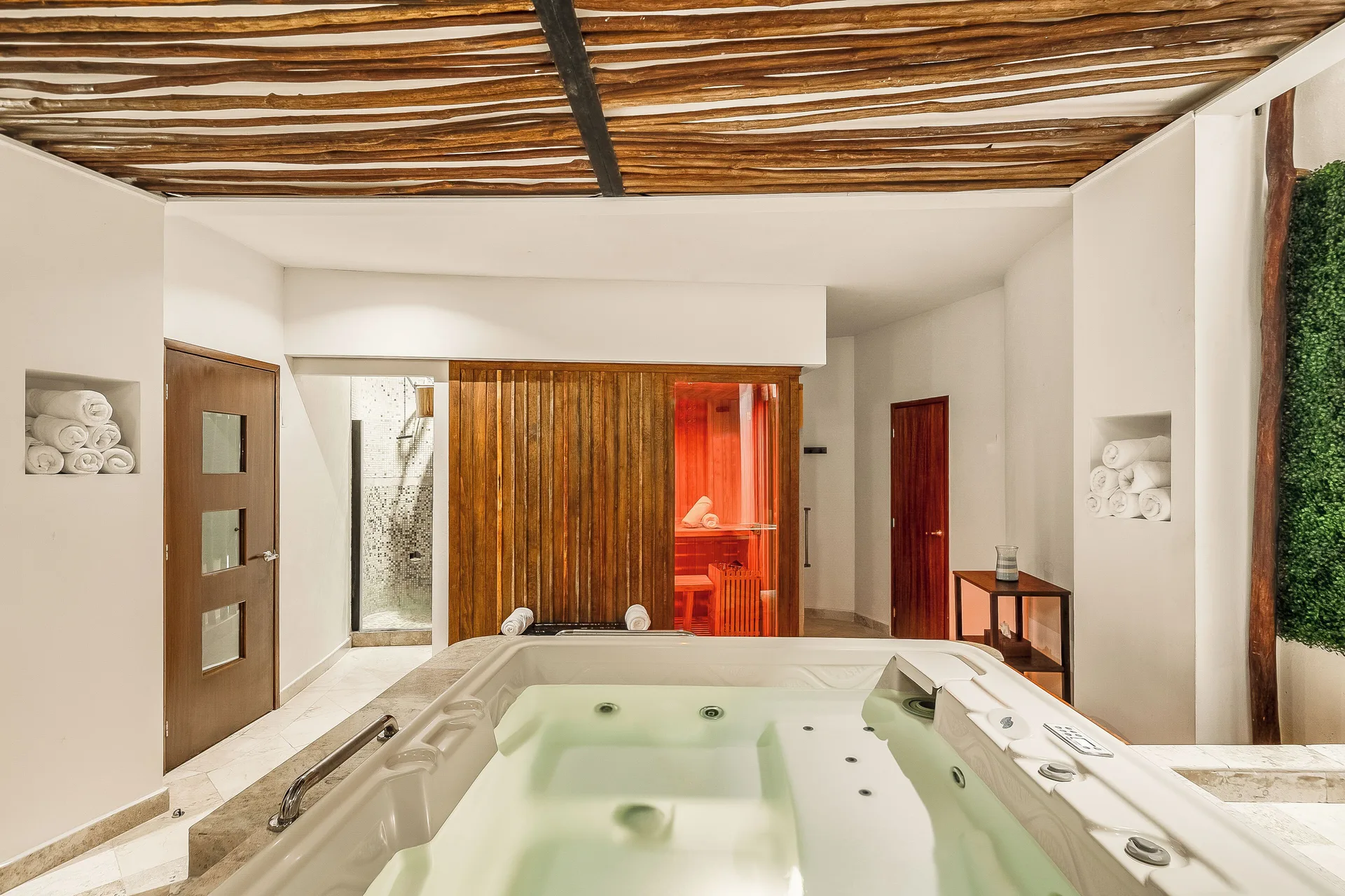 Spa hydrotherapy area with whirlpool, shower and sauna at Fiesta Americana Cancun Villas.