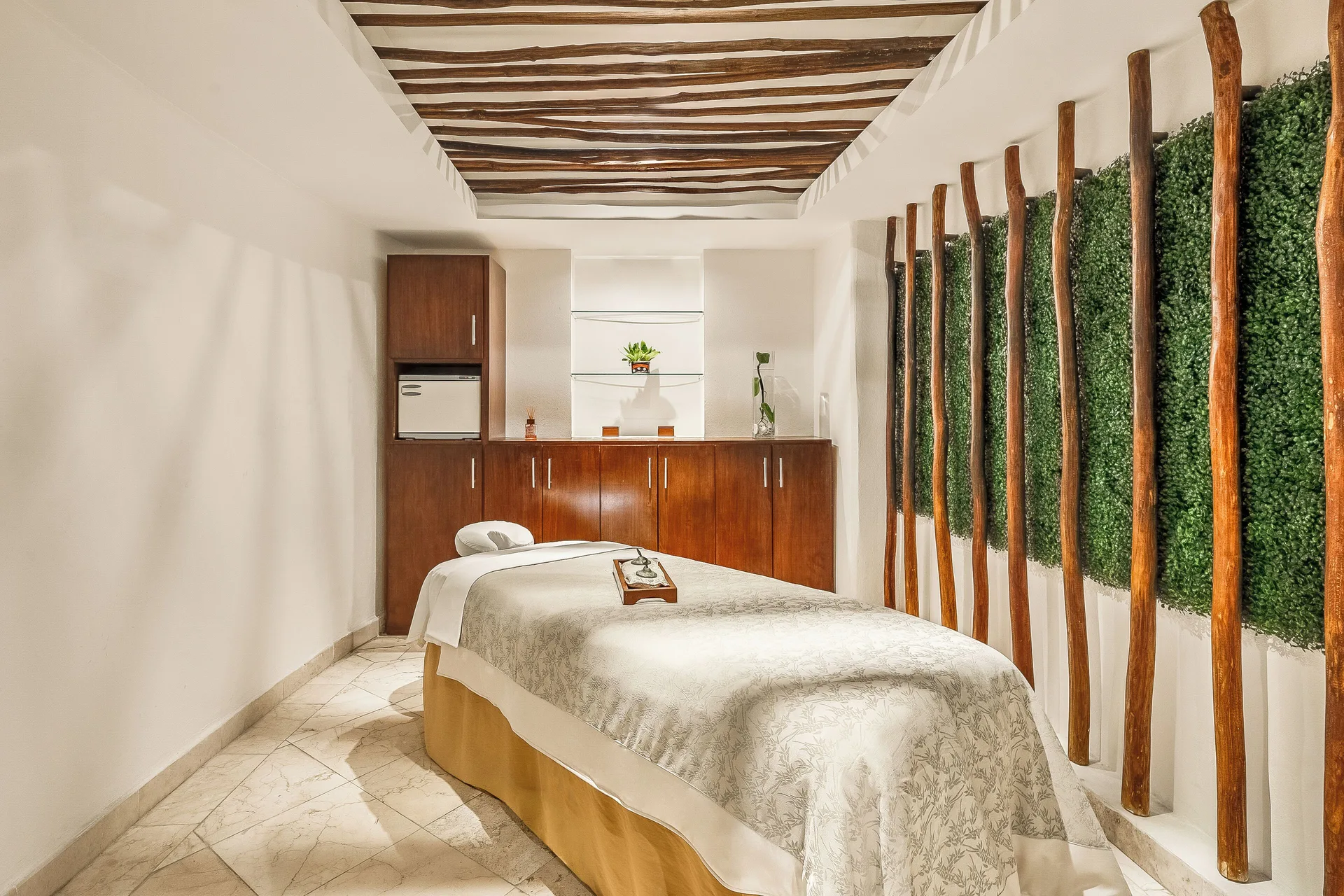 Spa treatment room with a massage table at Fiesta Americana Cancun Villas.