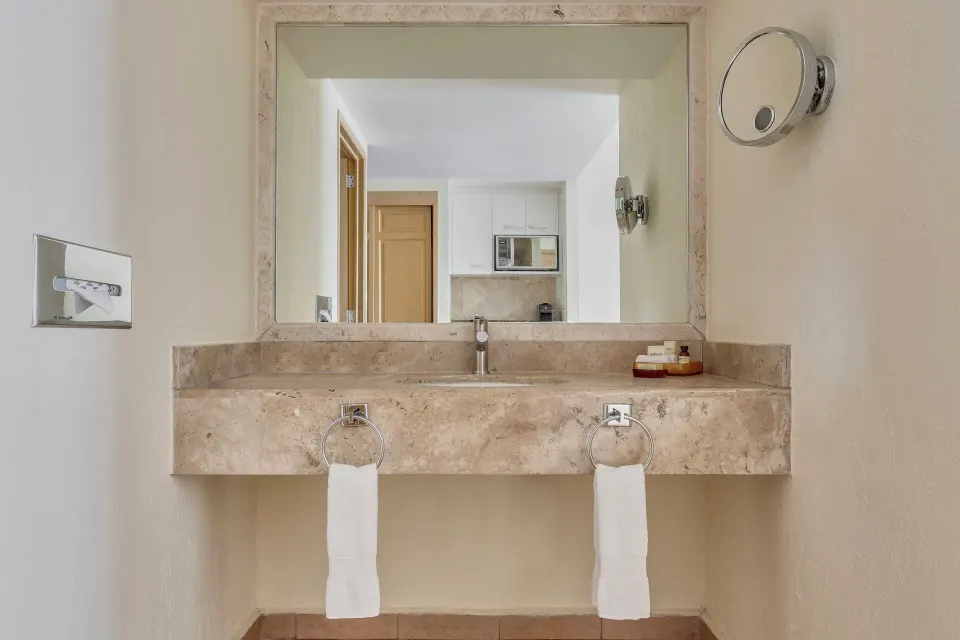 Deluxe Villa bathroom vanity with large mirror at Fiesta Americana Cancun Villas.