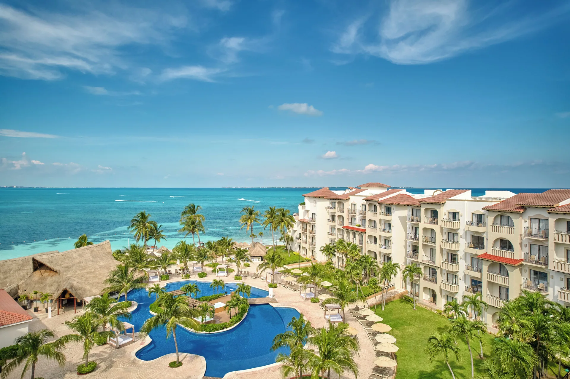 Premium Villa Master Suite balcony view of pools and ocean at Fiesta Americana Cancun Villas.