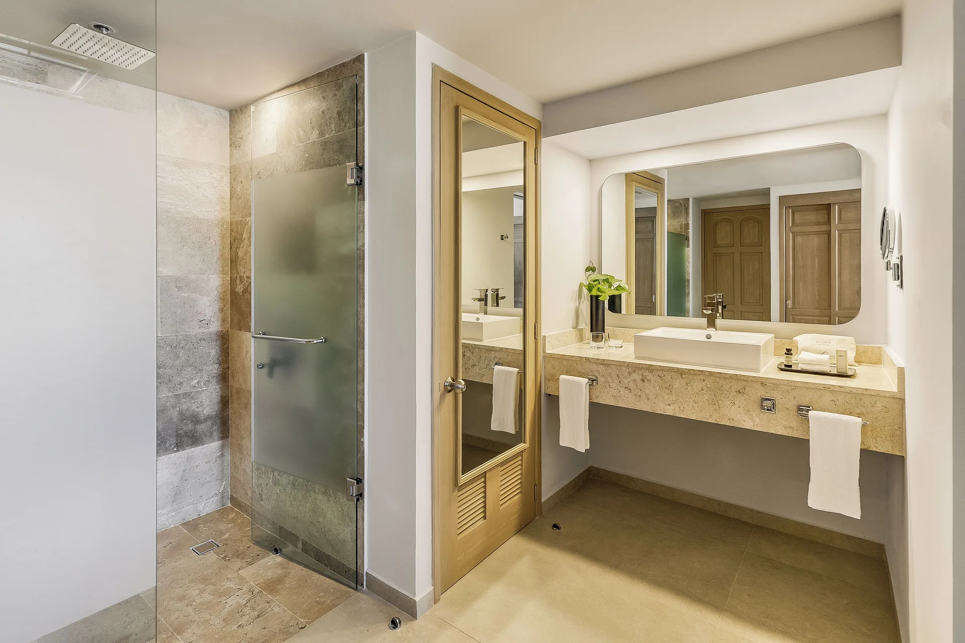 Premium Villa Master Suite bathroom with shower and vanity at Fiesta Americana Cancun Villas.