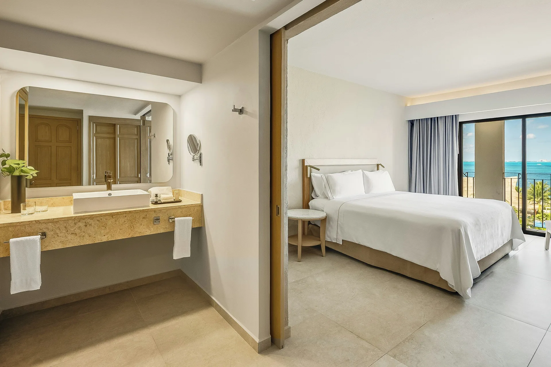 Premium Villa Master Suite bedroom and vanity at Fiesta Americana Cancun Villas.