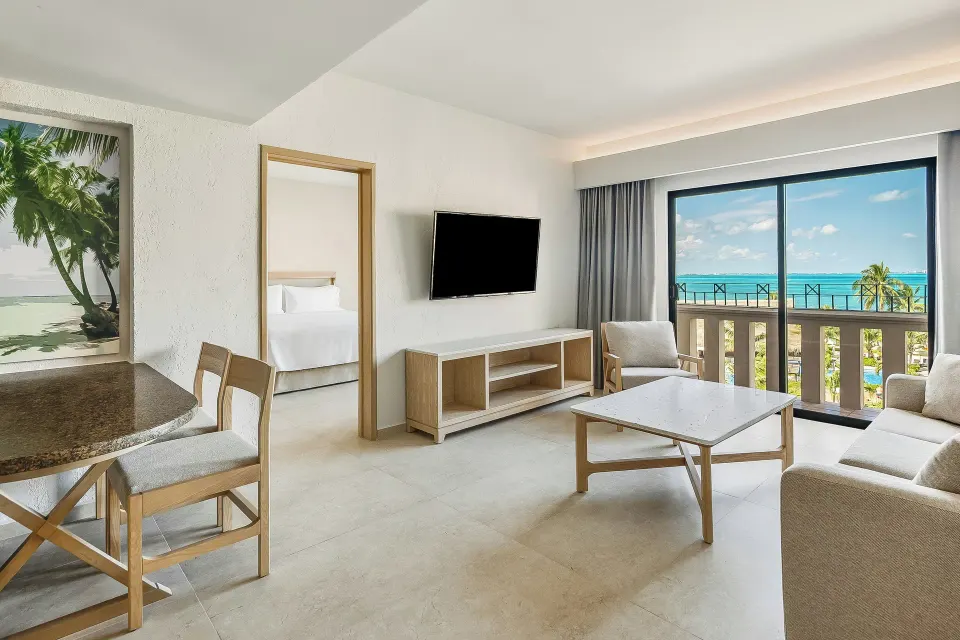 Premium Villa Master Suite living area with ocean balcony at Fiesta Americana Cancun Villas.