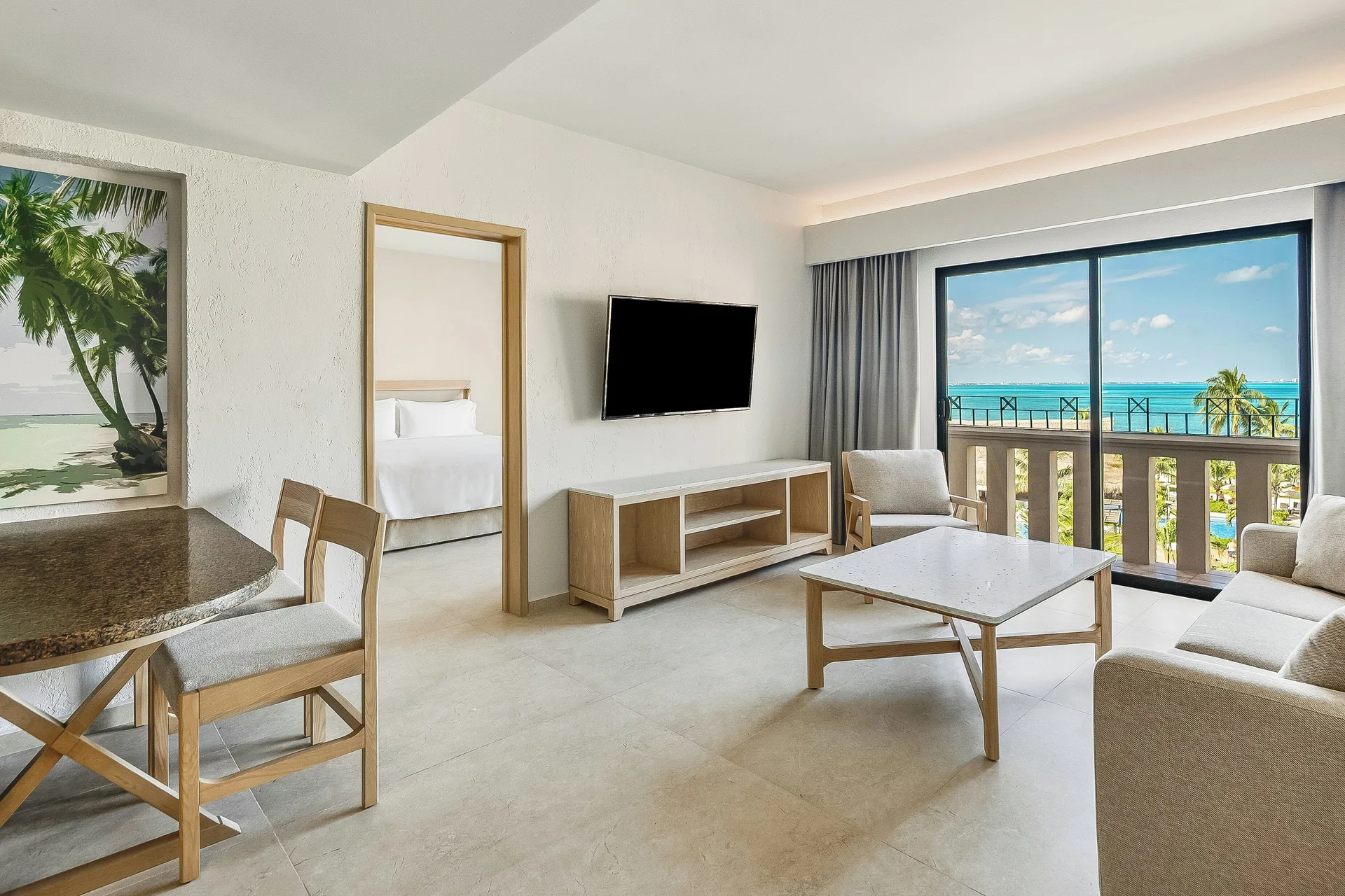 Premium Villa Master Suite living area with ocean balcony at Fiesta Americana Cancun Villas.