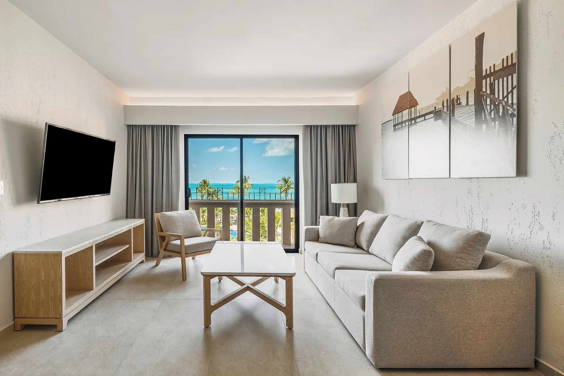 Premium Villa Master Suite sitting room with sofa at Fiesta Americana Cancun Villas.