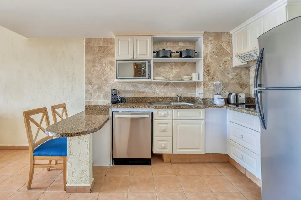 Villa Master Suite kitchenette with bar seating at Fiesta Americana Cancun Villas.
