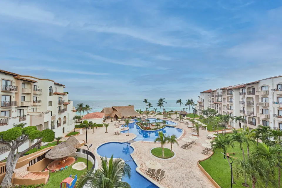 Villa Master Suite resort view at Fiesta Americana Cancun Villas overlooking pools and the sea.