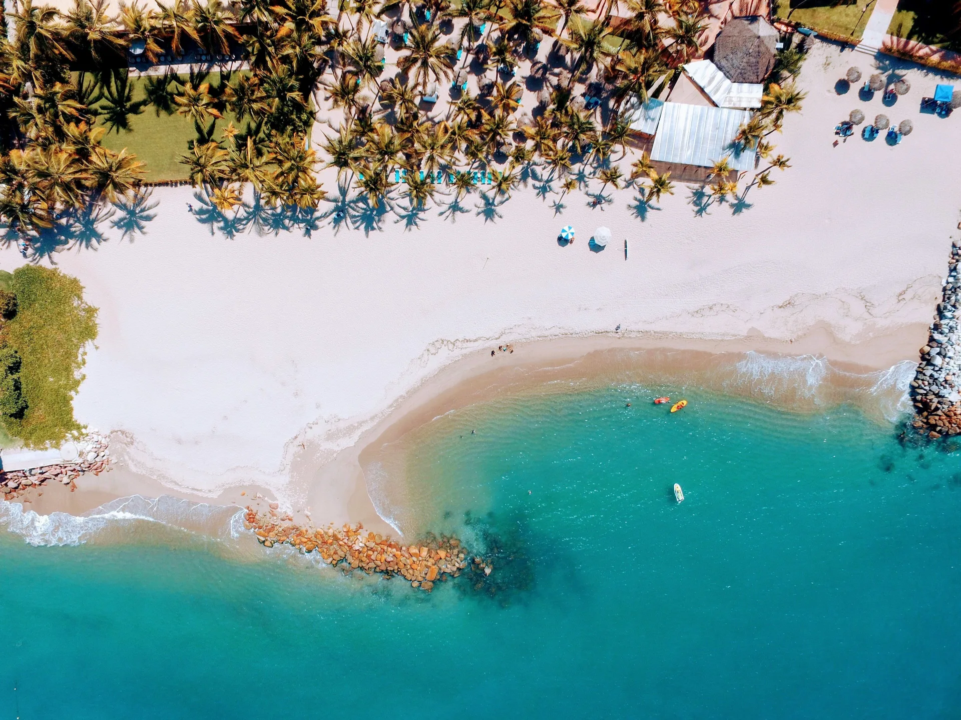 Aerial view of sandy beach and turquoise water at Fiesta Americana Puerto Vallarta & Spa.