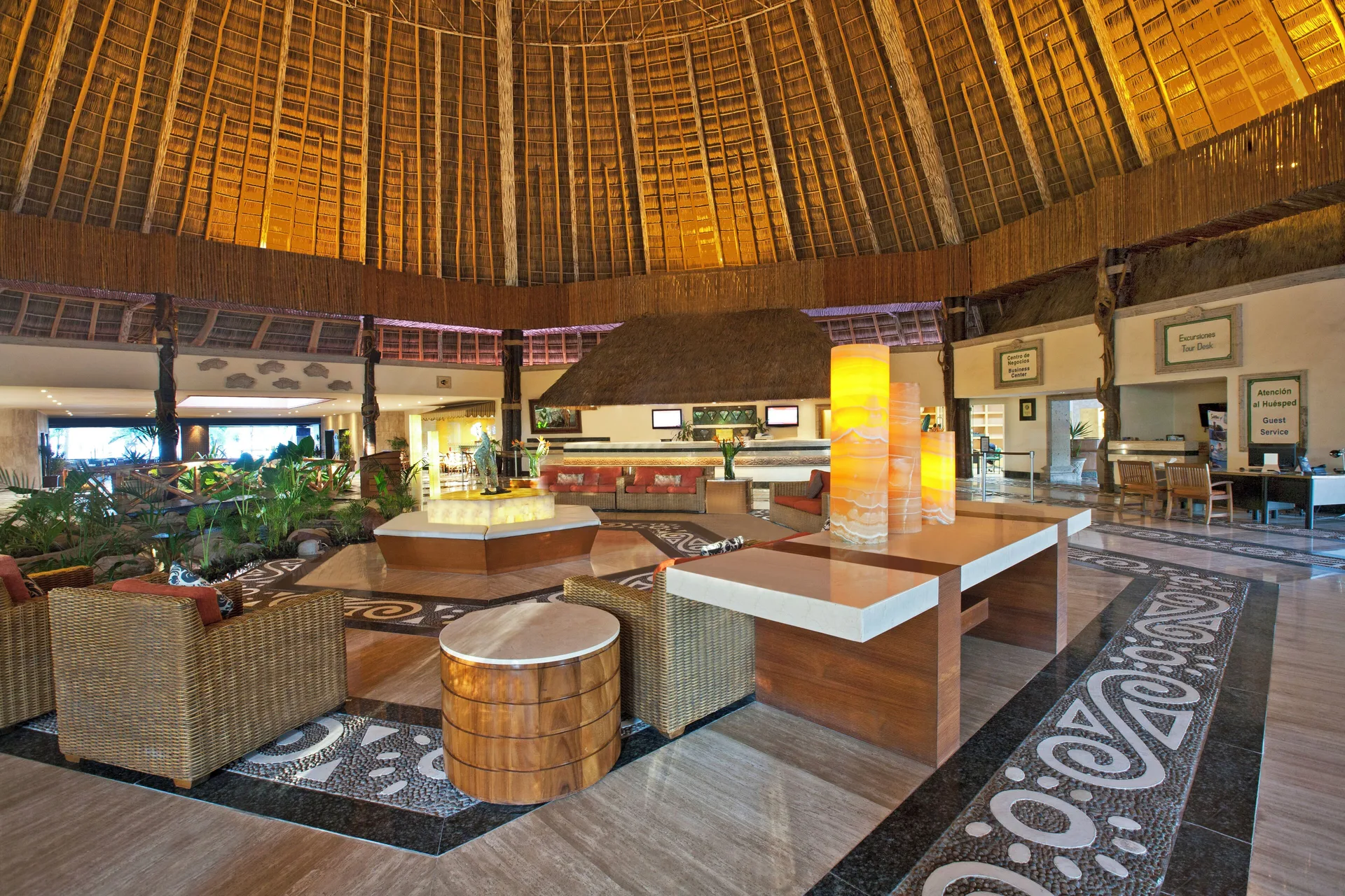 Open lobby with a high palapa-style ceiling at Fiesta Americana Puerto Vallarta & Spa.