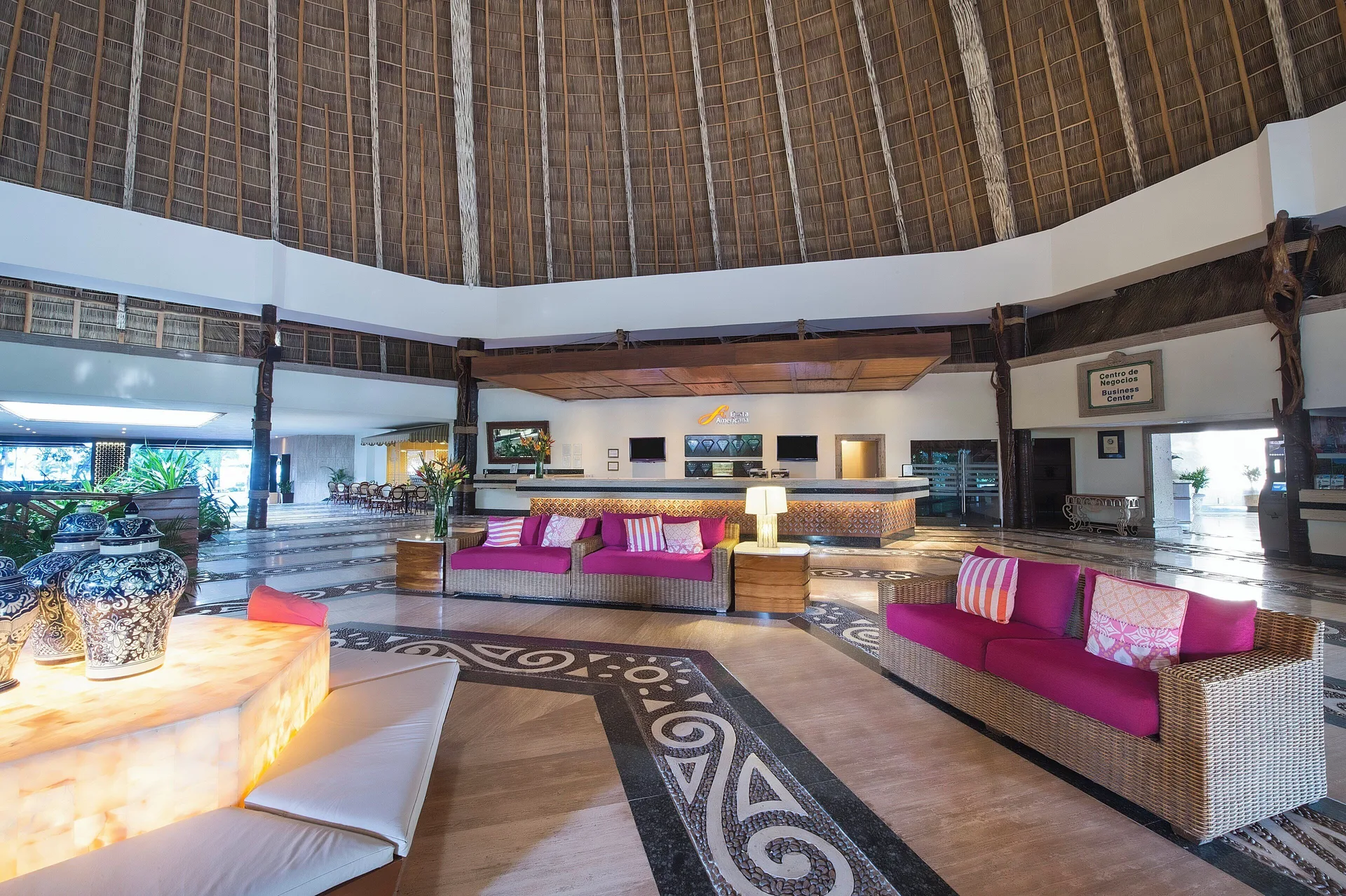 Wide lobby lounge with wicker sofas at Fiesta Americana Puerto Vallarta & Spa.