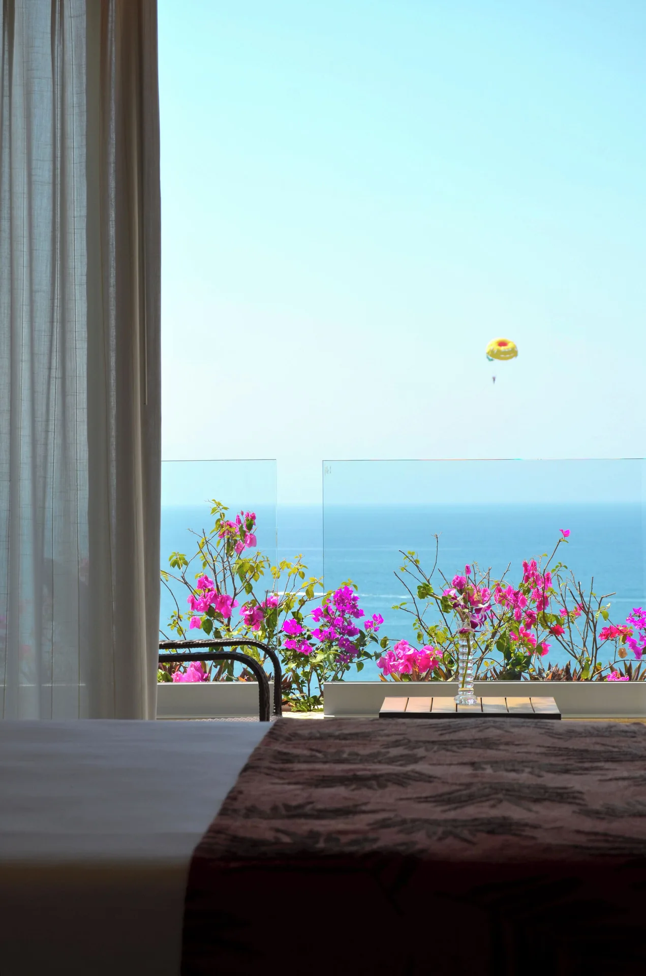 Ocean-view room balcony with flowers at Fiesta Americana Puerto Vallarta & Spa