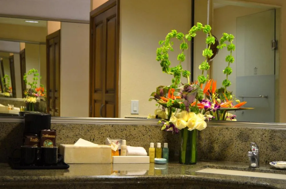 Family Room bathroom vanity with flowers at Fiesta Americana Puerto Vallarta & Spa.