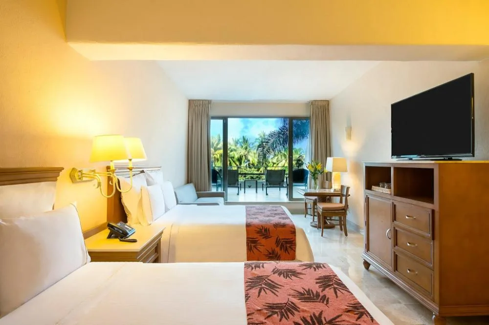 Family Room with two beds and balcony at Fiesta Americana Puerto Vallarta & Spa.