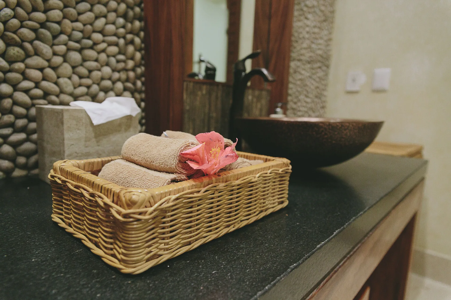 Honeymoon Suite bathroom vanity with towels and flower at Fiesta Americana Puerto Vallarta & Spa.