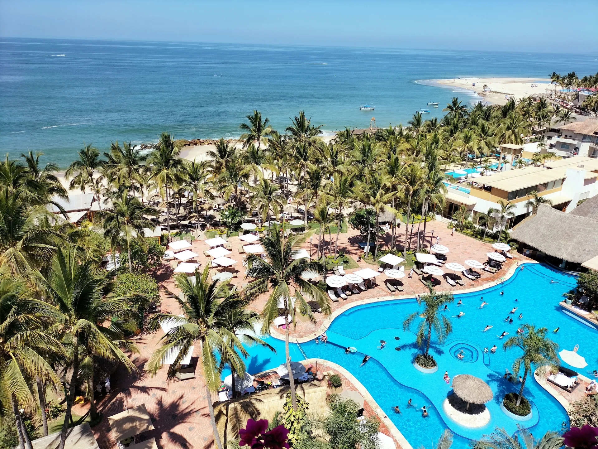 Honeymoon Suite view of pool, palms, beach, and ocean at Fiesta Americana Puerto Vallarta & Spa.