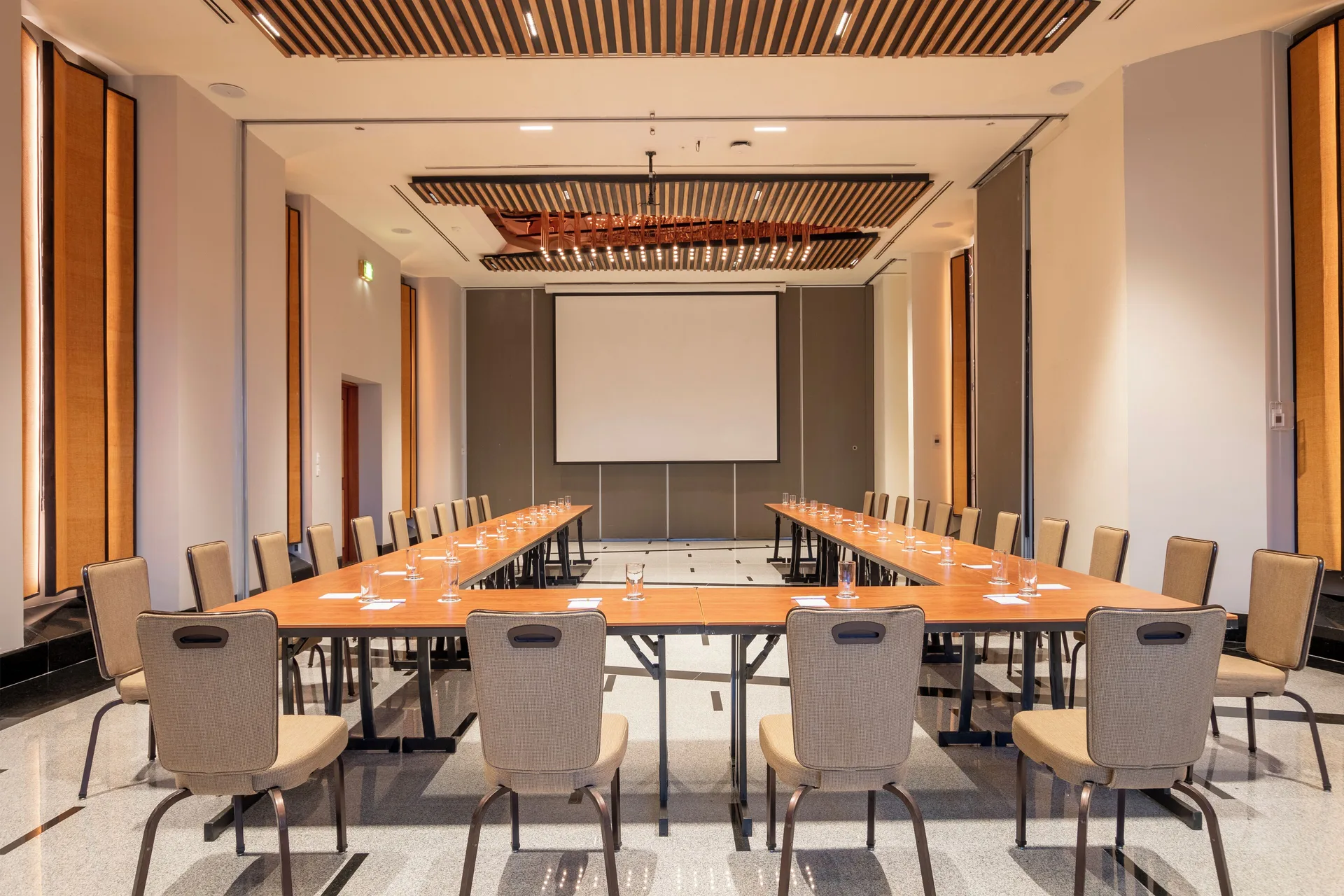 Meeting room with U-shaped tables and screen at Fiesta Americana Puerto Vallarta & Spa.