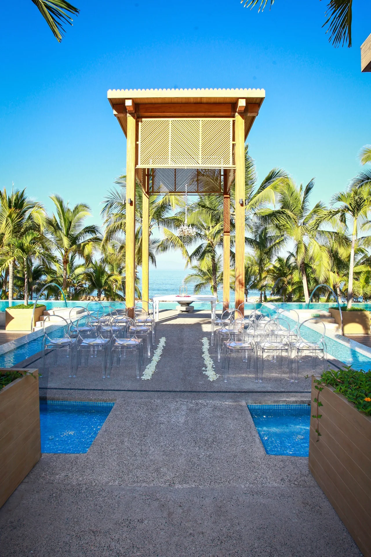 Outdoor ceremony aisle over the pool at Fiesta Americana Puerto Vallarta & Spa.
