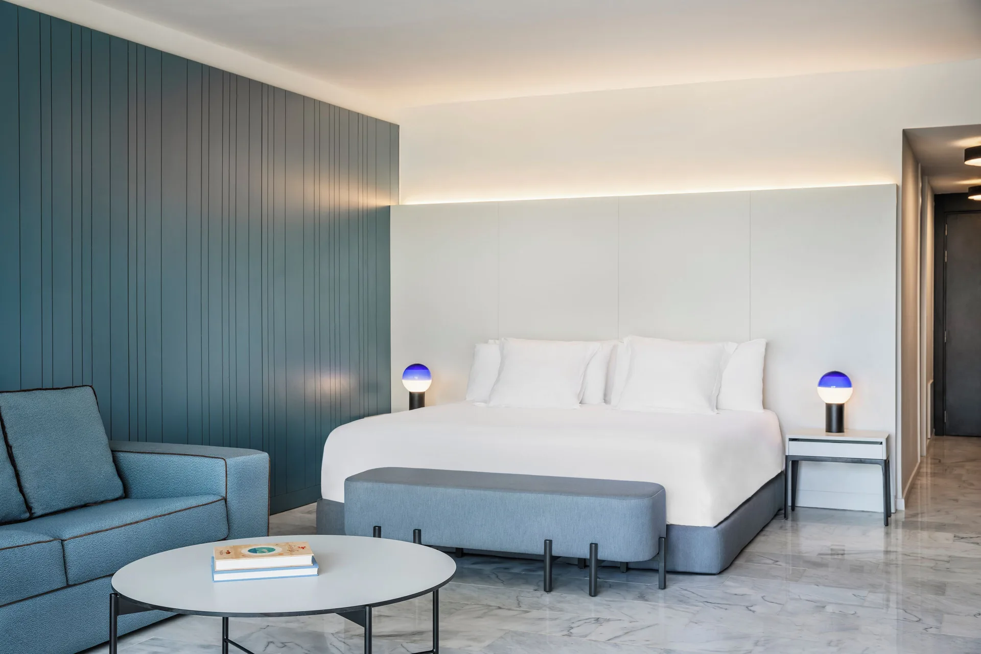 Junior Suite Garden or Pool View bedroom with king bed and sofa at Finest Punta Cana.