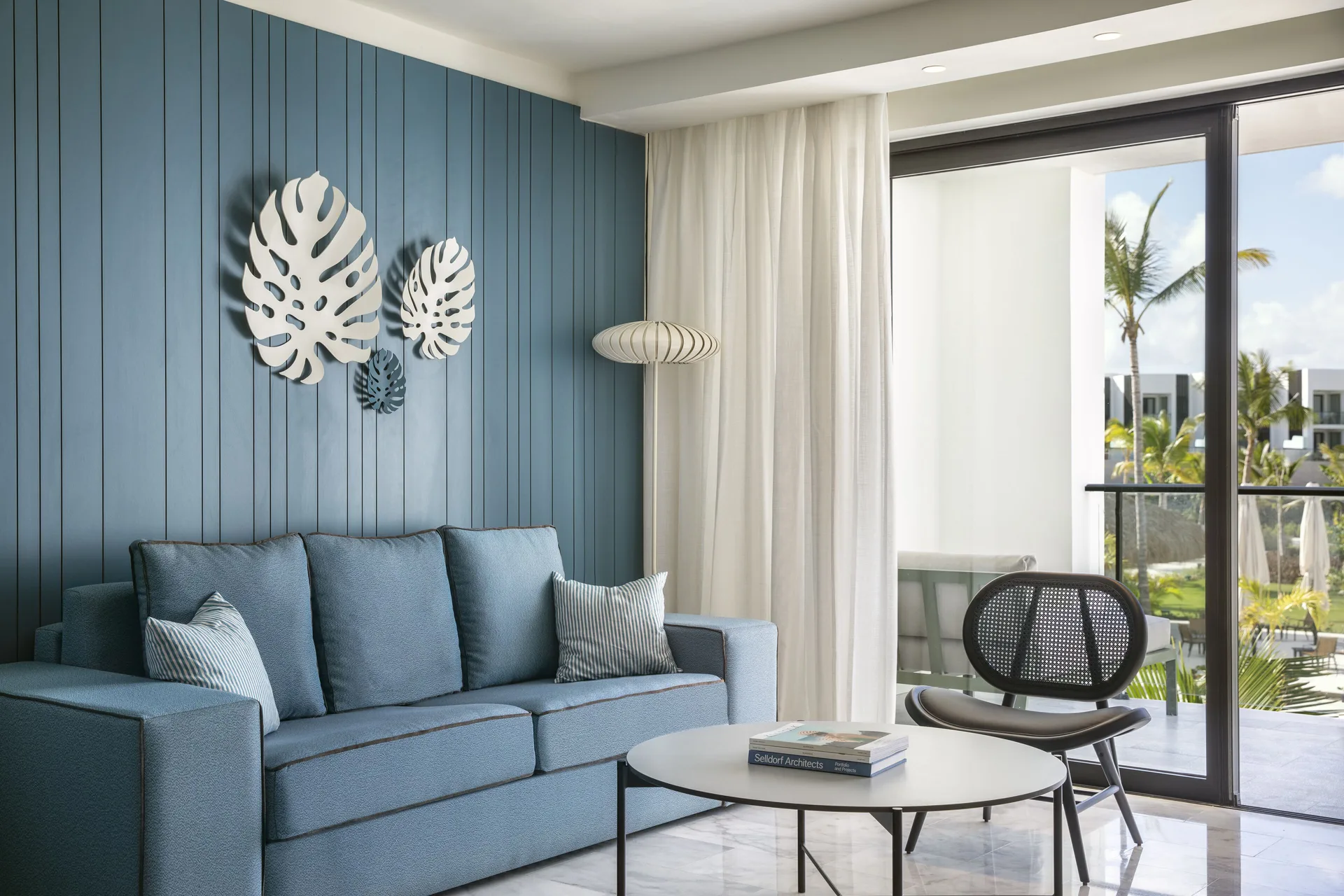 Junior Suite Garden or Pool View sitting area with balcony at Finest Punta Cana.