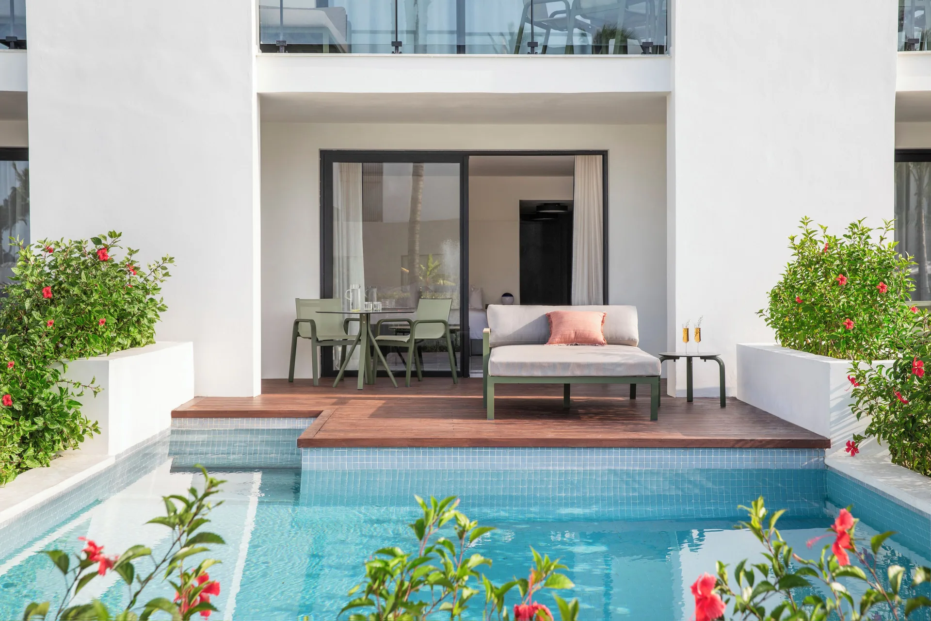 Junior Suite private pool terrace with daybed and dining area at Finest Punta Cana.
