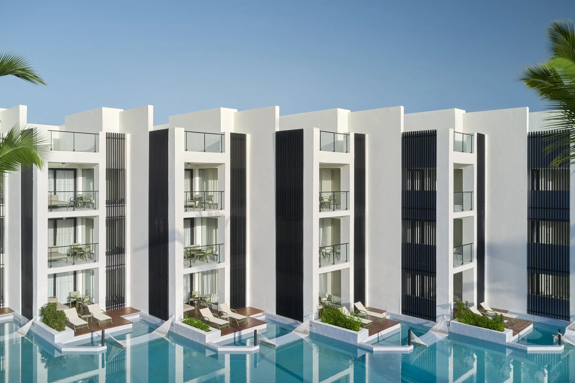 Junior Swim-Up Suite building with poolside terraces at Finest Punta Cana.