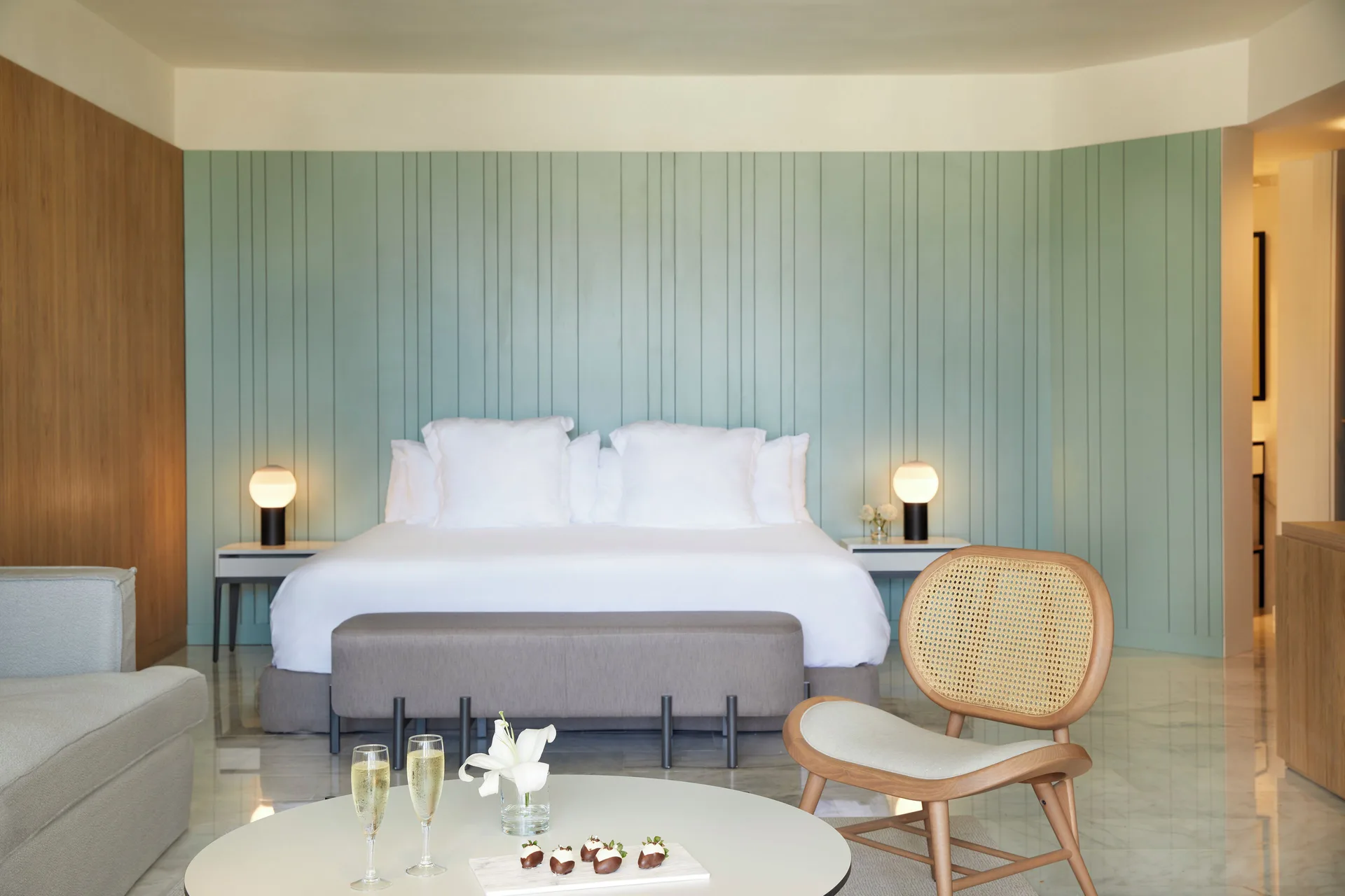 King bed, sitting area, and table in a Terrace Suite with Plunge Pool at Finest Punta Cana.