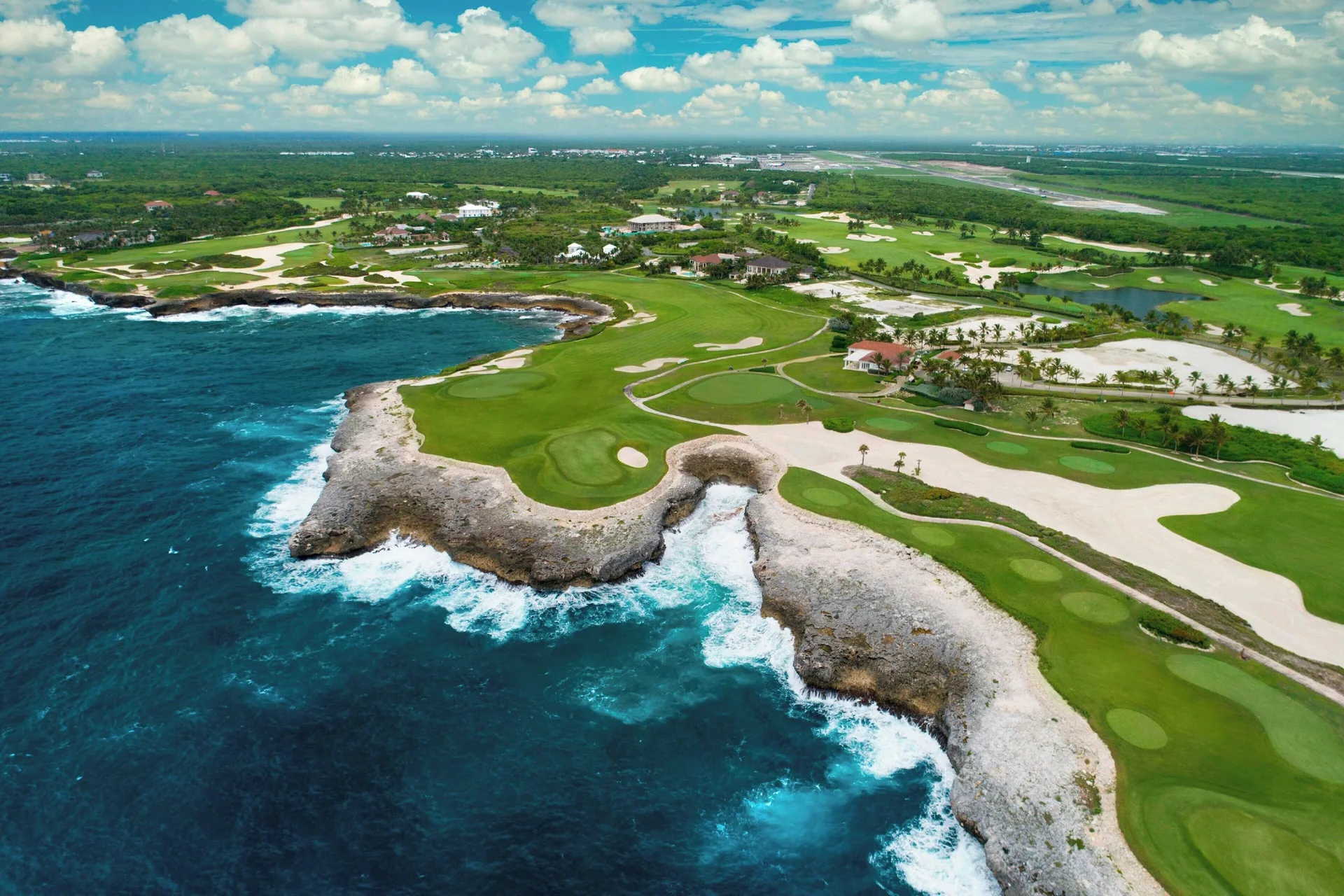 Aerial coastline and golf course near Four Points Puntacana Village.