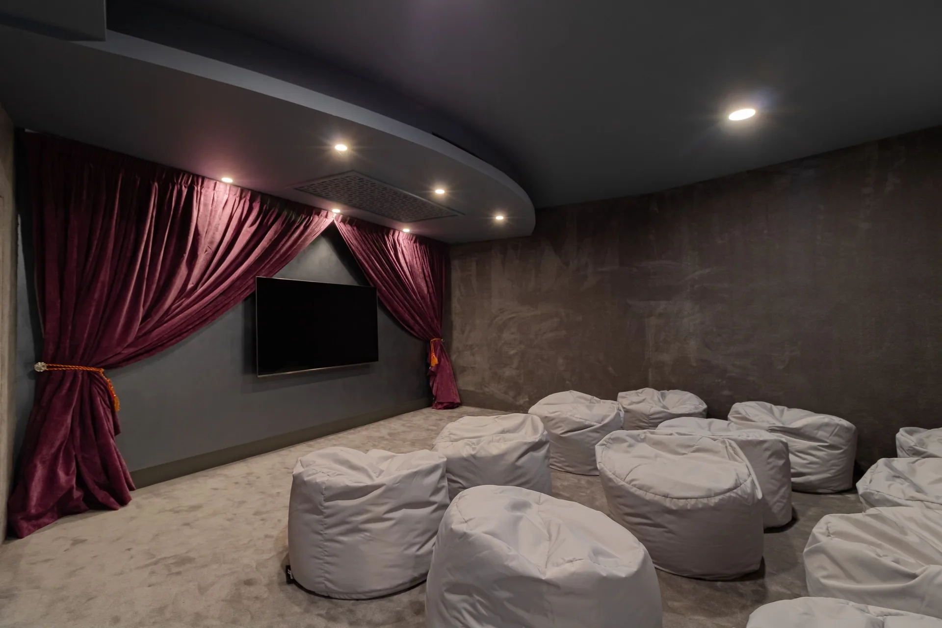 Small screening room with beanbag seating at Garza Blanca Los Cabos.