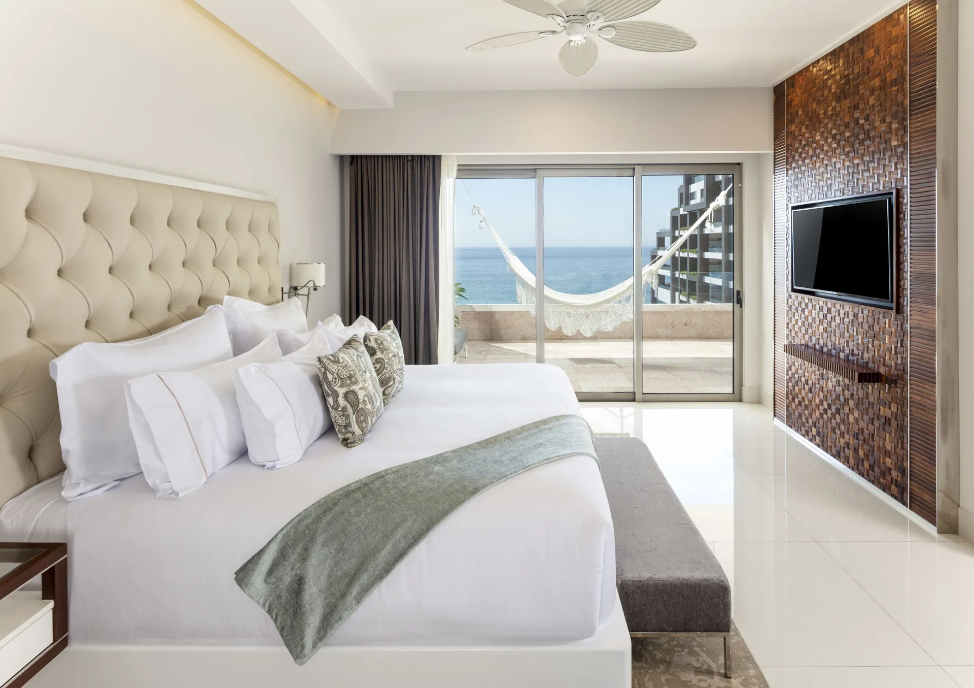 1 Bedroom Ocean View bedroom with king bed and balcony hammock at Garza Blanca Los Cabos.