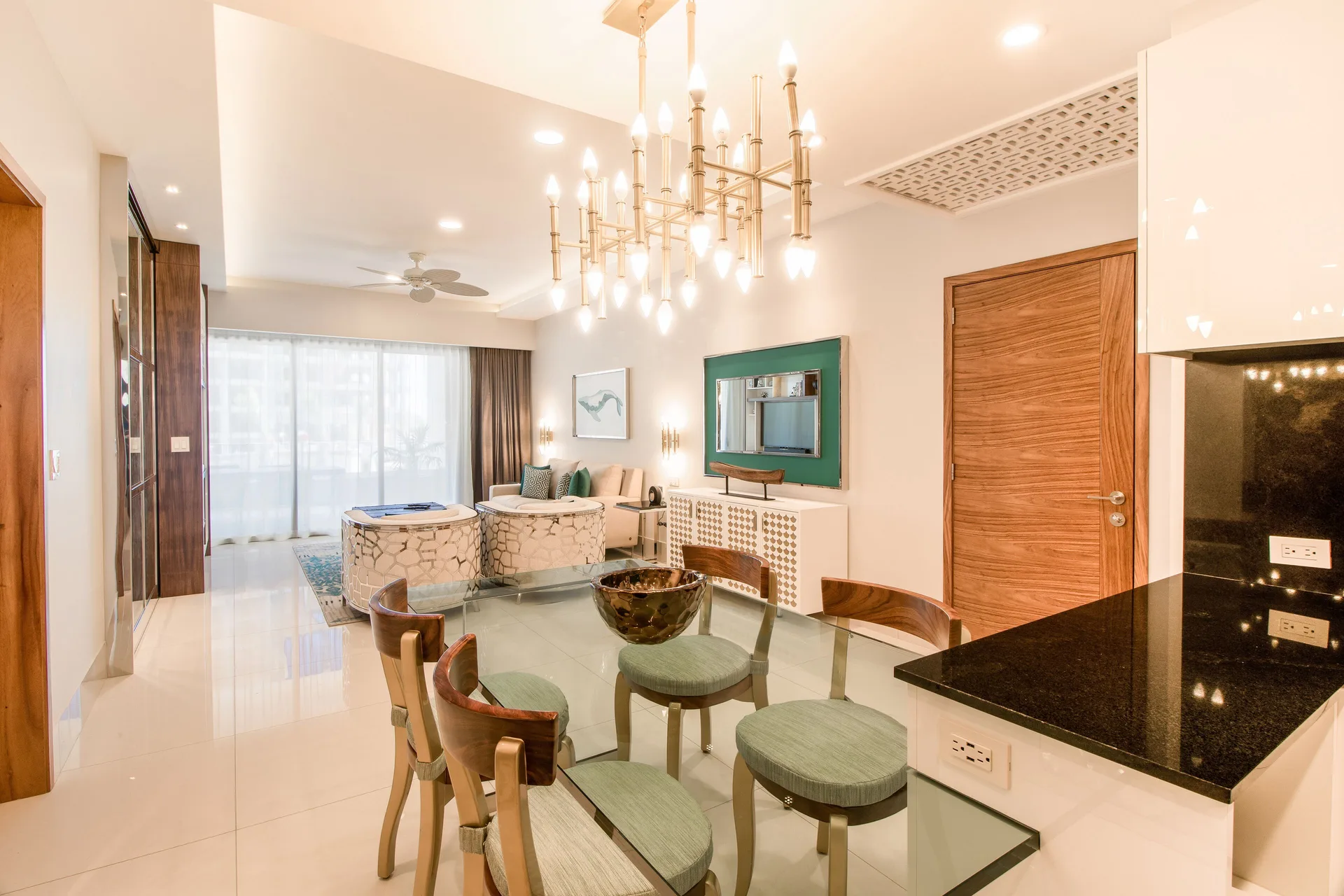 1 Bedroom Suite dining and living area with kitchenette at Garza Blanca Los Cabos.