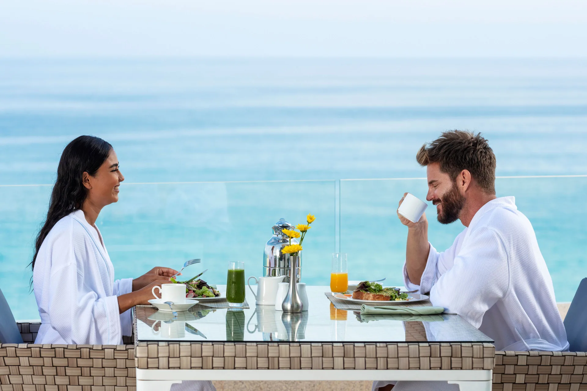 Guests having breakfast on a One Bedroom Suite terrace at Garza Blanca Los Cabos.