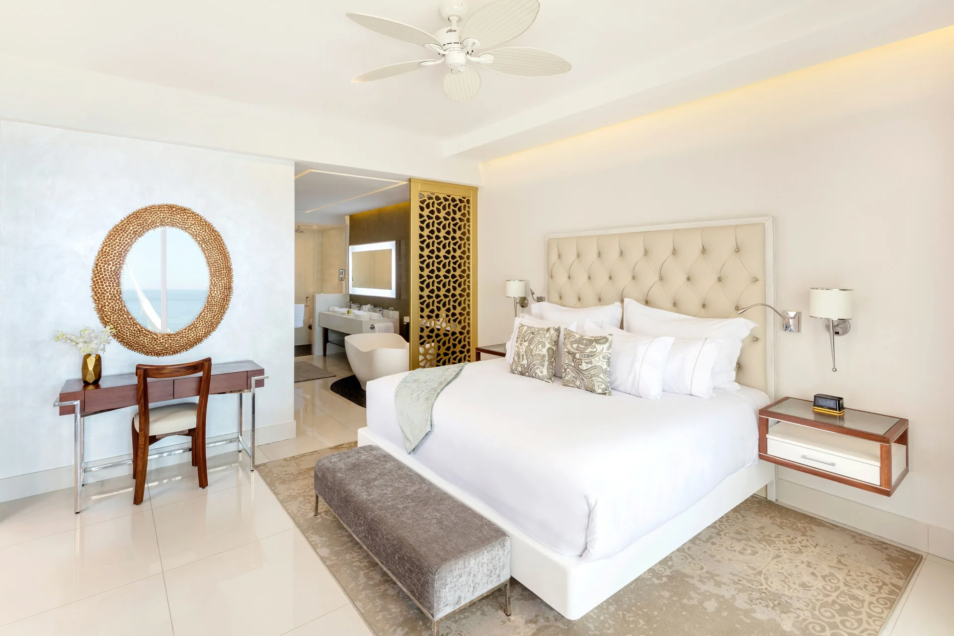 King bedroom in a 2 Bedroom Suite Ocean View at Garza Blanca Los Cabos with vanity and open bath area.