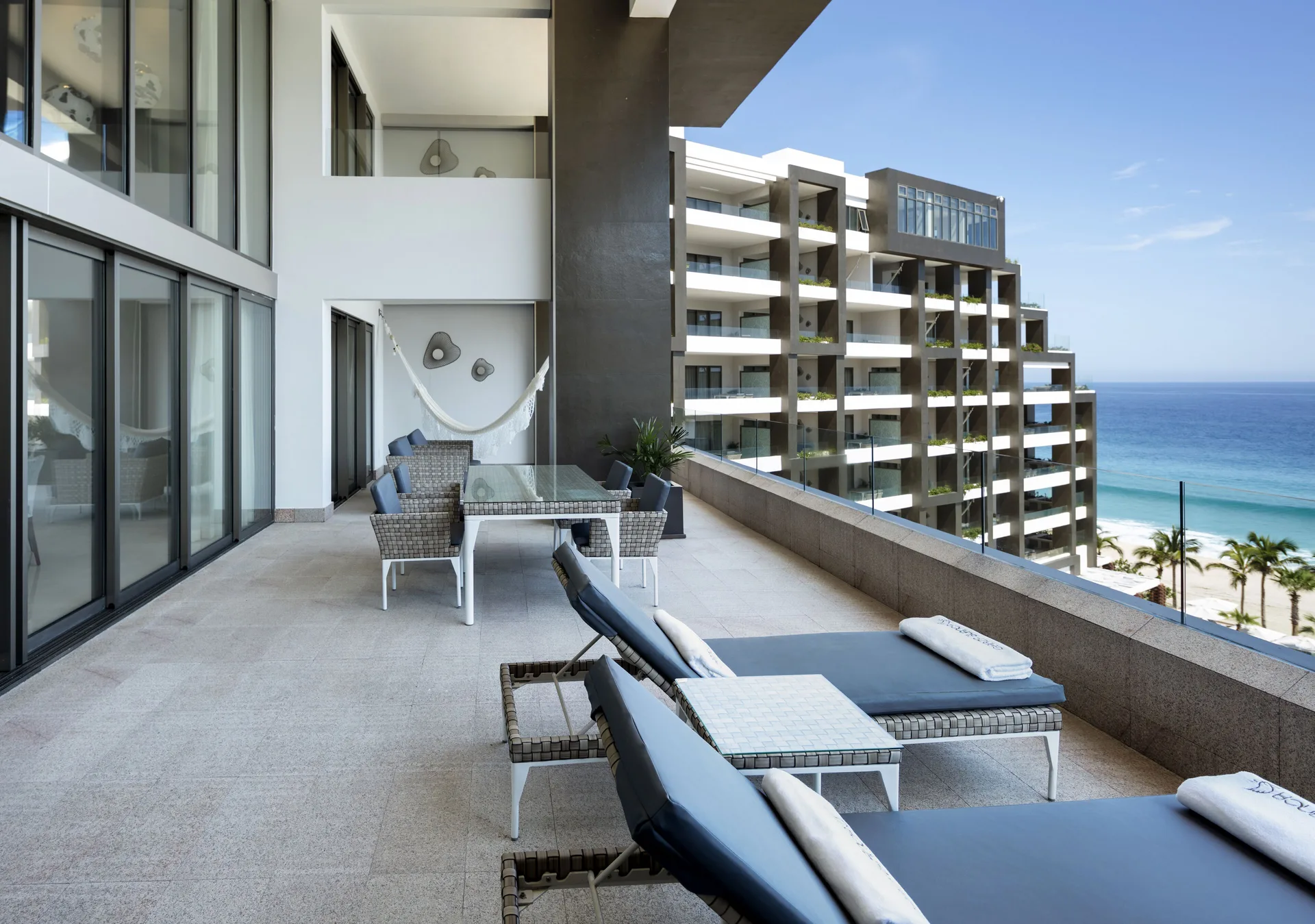 4 Bedroom Loft Ocean View terrace with loungers and ocean at Garza Blanca Los Cabos.