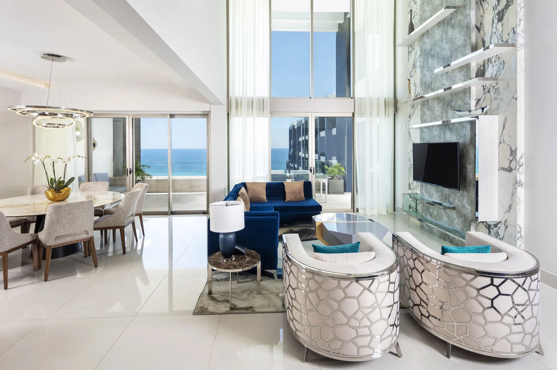 Oceanfront penthouse living and dining room at Garza Blanca Los Cabos with terrace and sea views.