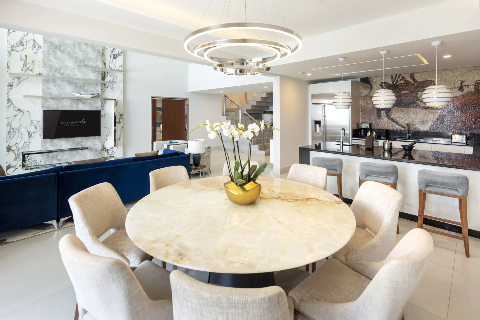 Loft Ocean View dining table, kitchen, and lounge at Garza Blanca Los Cabos.
