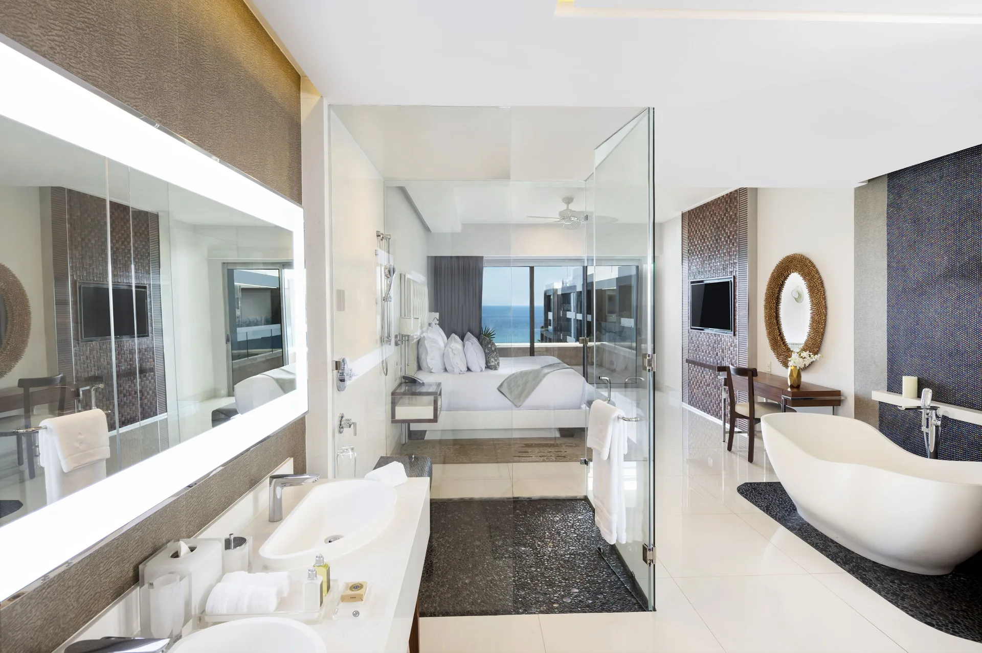 Loft Ocean View bathroom and king bedroom beyond at Garza Blanca Los Cabos.