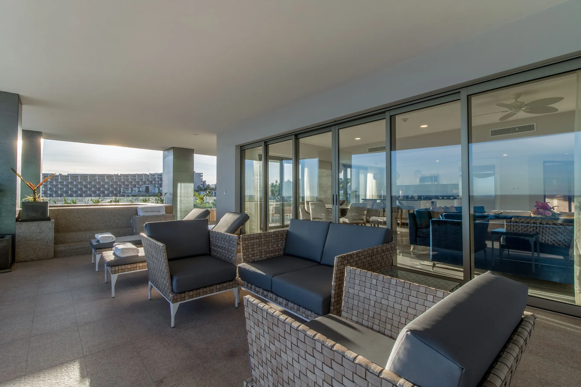 Covered terrace seating for a 3 Bedroom Ocean View Suite at Garza Blanca Los Cabos.