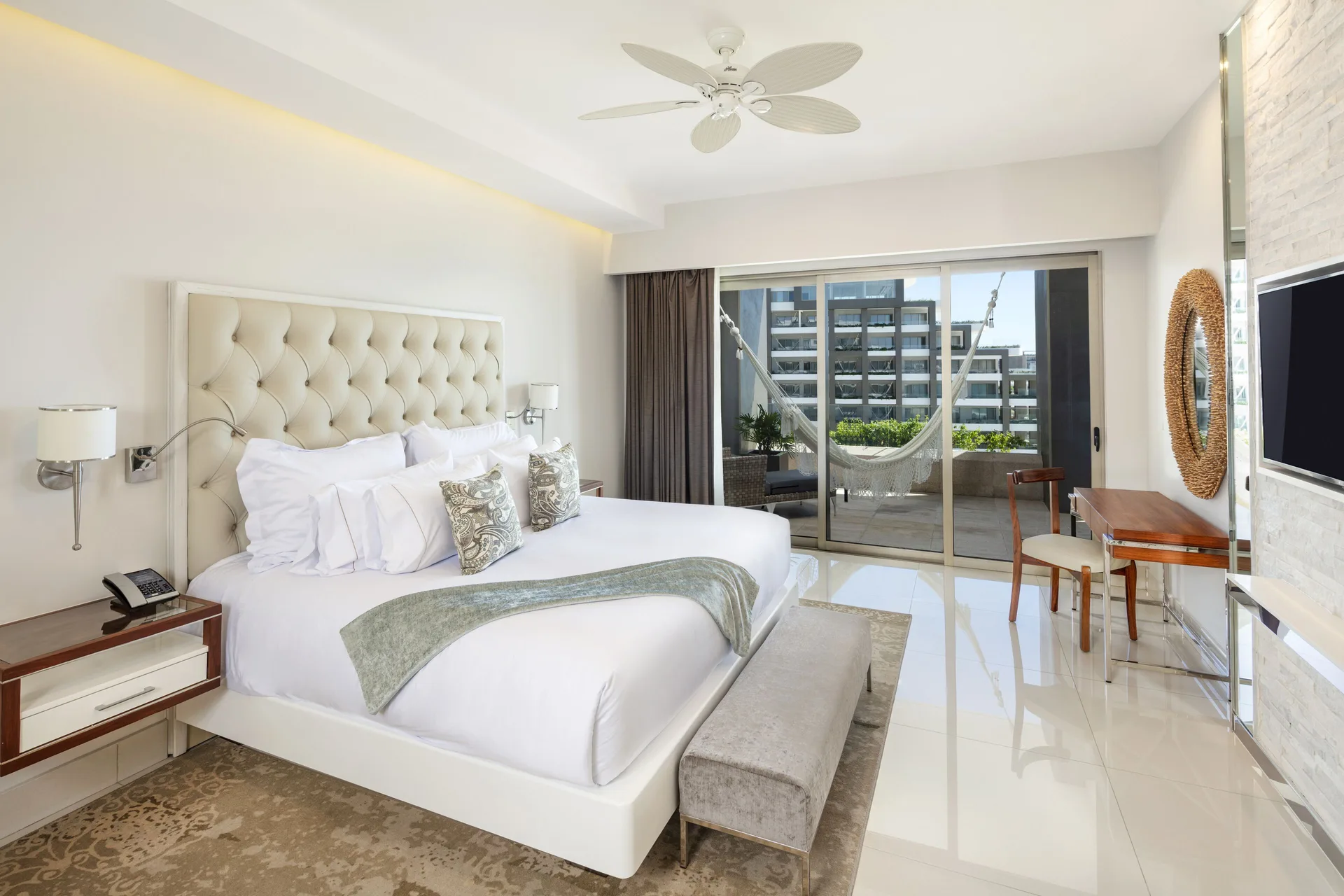 King bedroom with balcony hammock in a 3 Bedroom Suite at Garza Blanca Los Cabos.