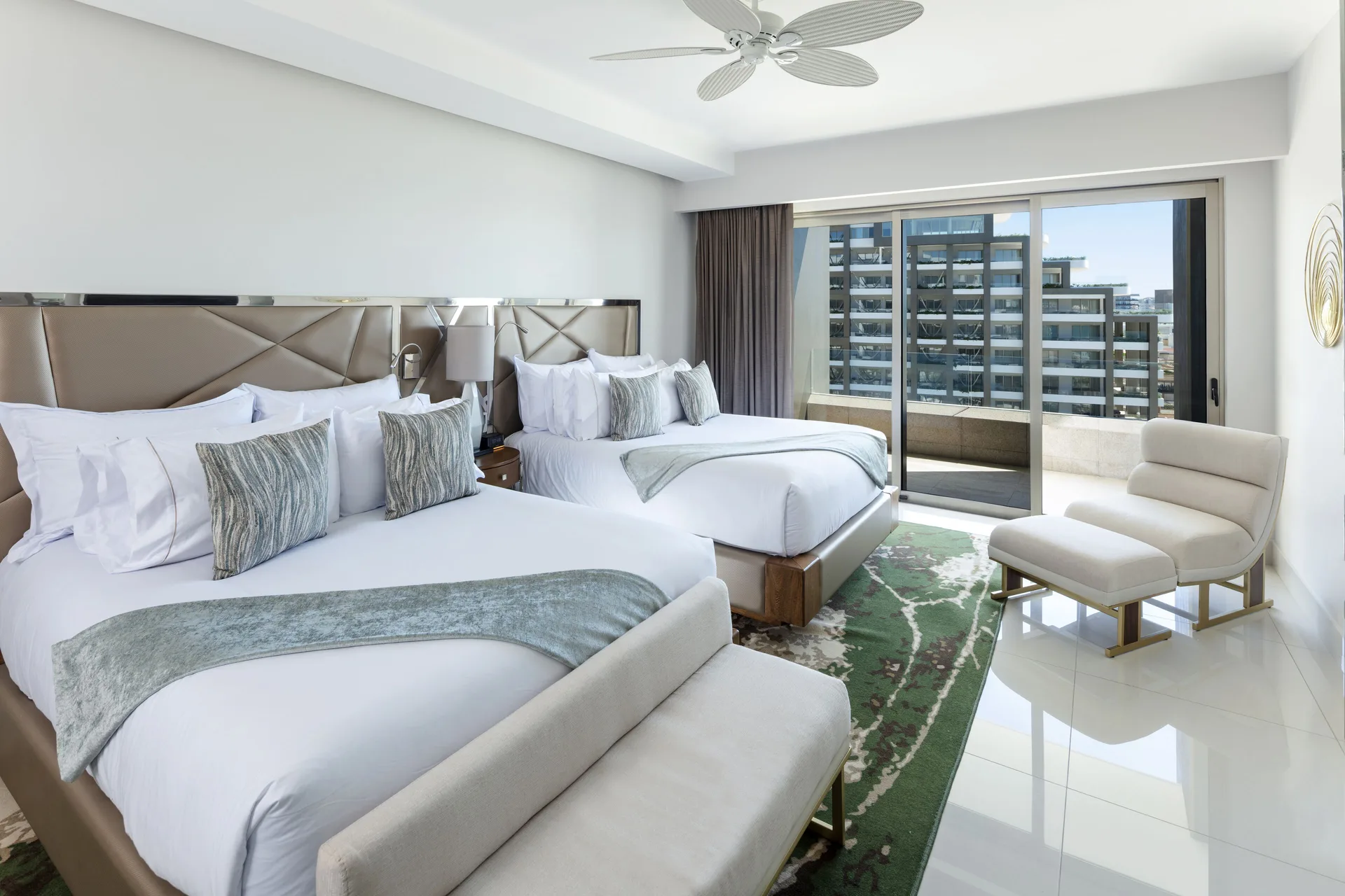 Two-bed guest room with balcony in a 3 Bedroom Suite at Garza Blanca Los Cabos.