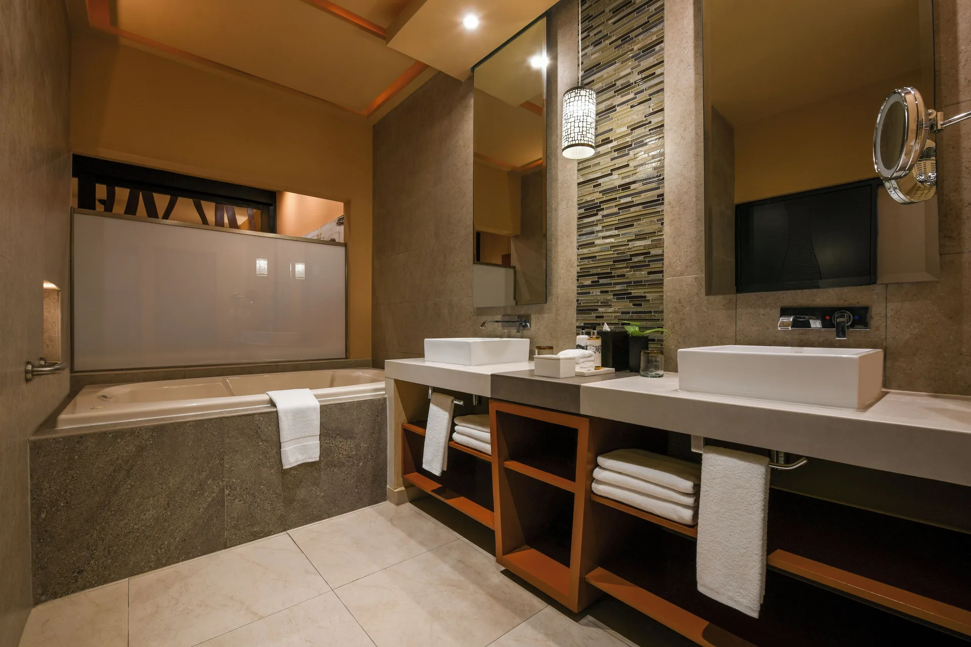 Oceanfront Swim Up Suite bathroom with tub and double sinks at Generations Riviera Maya.